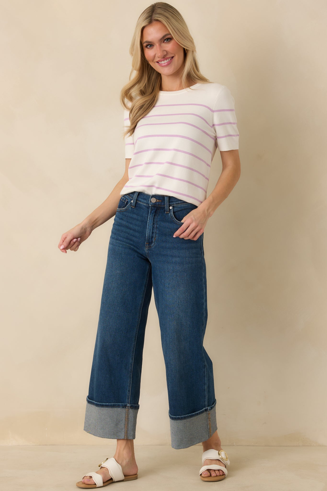 Lavender striped sweater with ribbed neckline, sleeves, and hem for a polished all-season look.