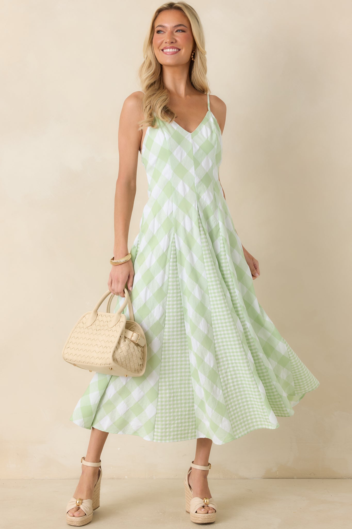 Gingham midi dress highlighting the layered check pattern, fitted bodice, and softly flared A-line skirt.
