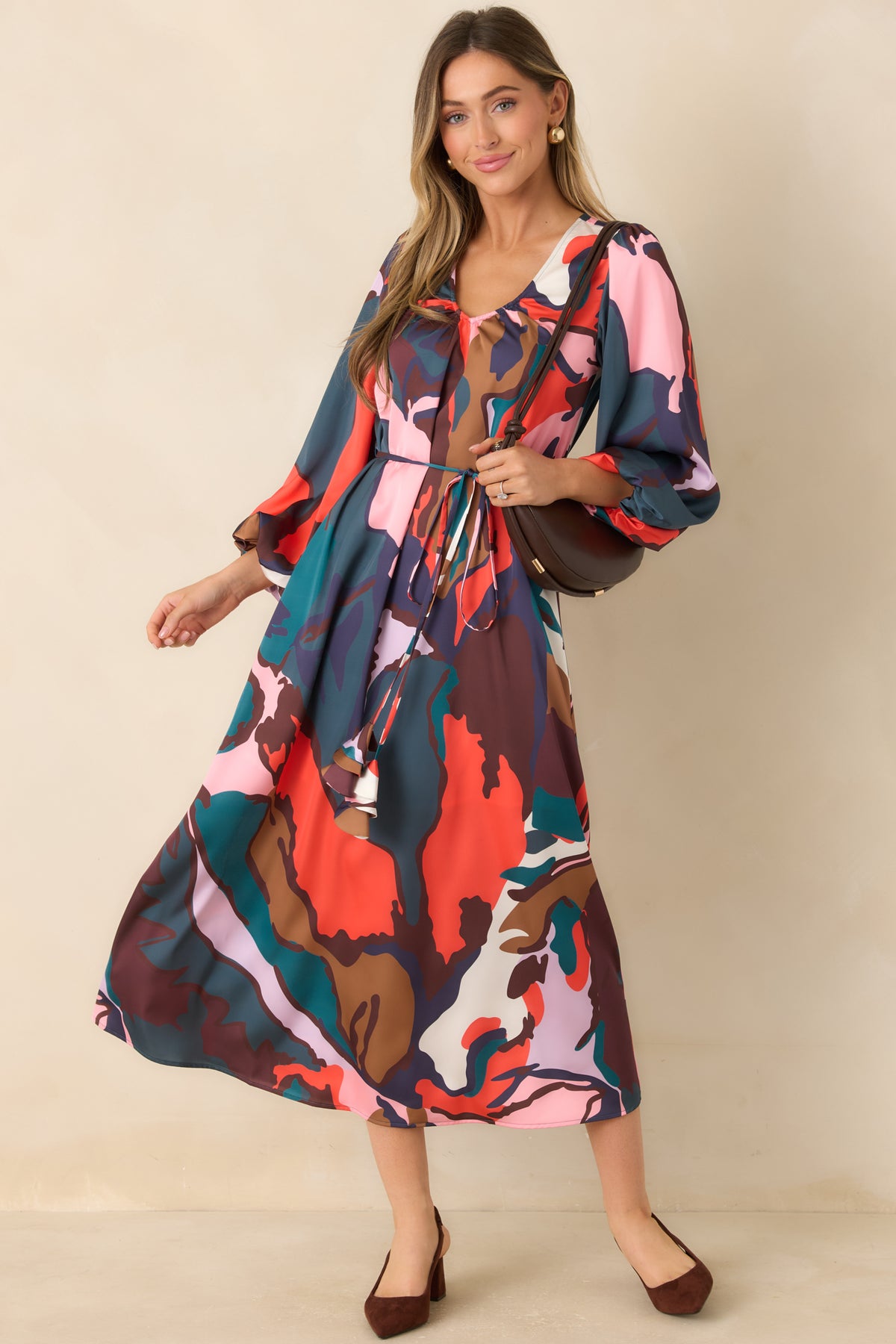 Leaf Study midi dress with oversized teal, coral, pink, and purple botanical shapes on a multicolor background.