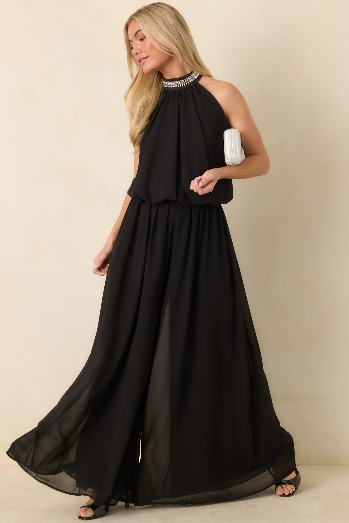 Cropped halter top with leafy rhinestone embellishments along the neckline and a softly rounded bubble hem.