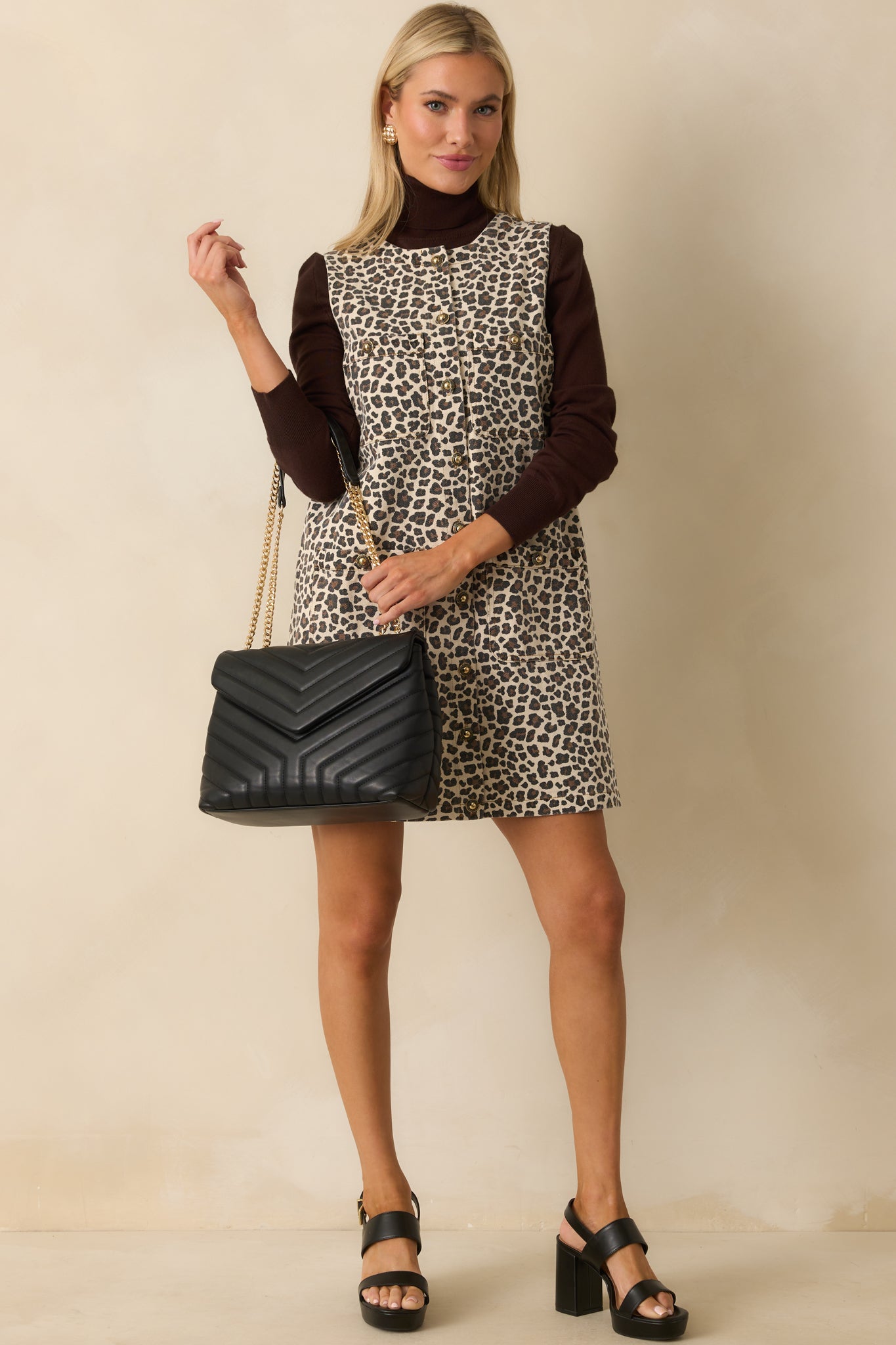 Leopard print mini dress showing structured denim fabric and straight silhouette.