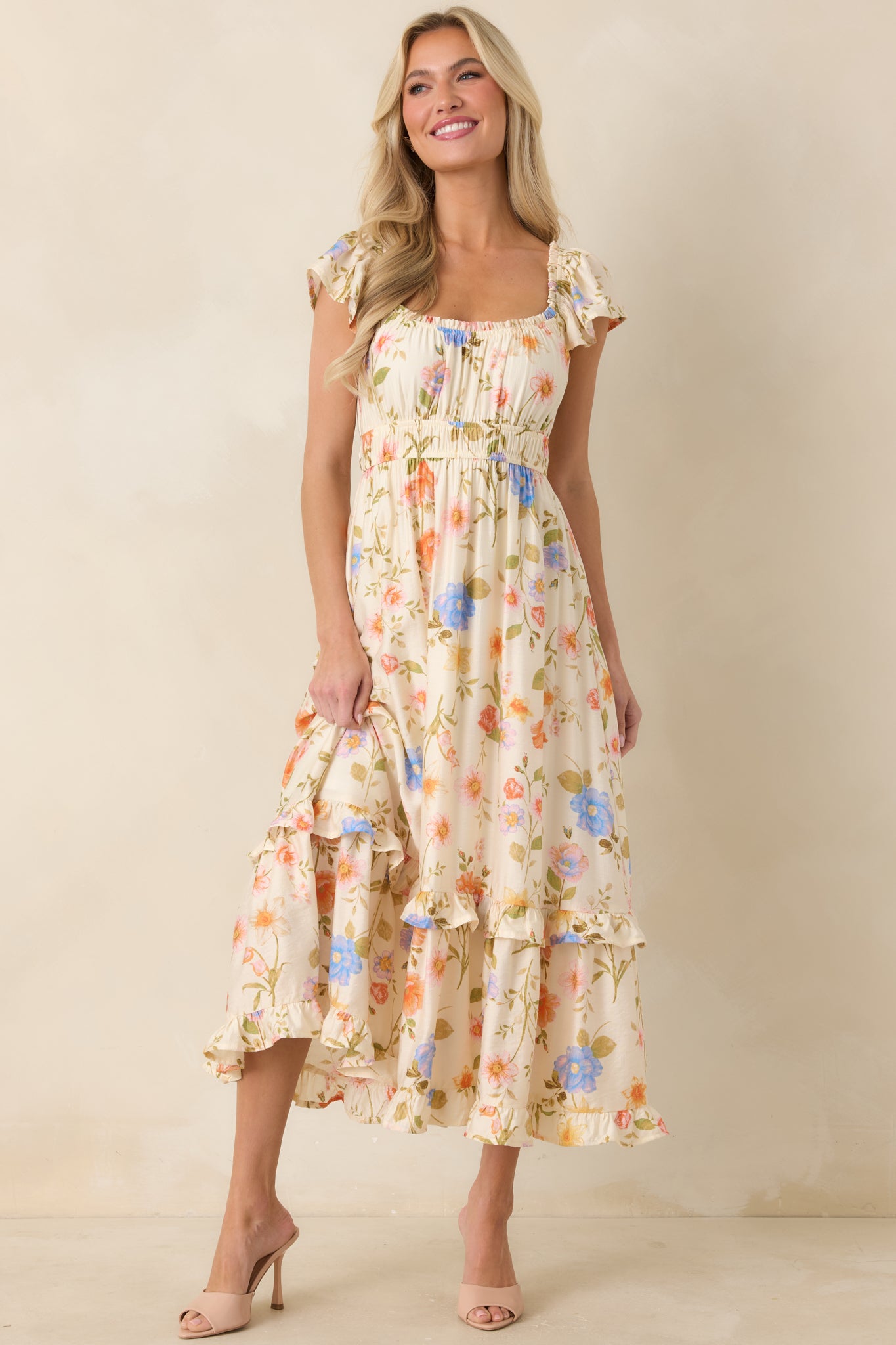 Light beige floral midi dress with elastic waist and easy, lightweight drape.