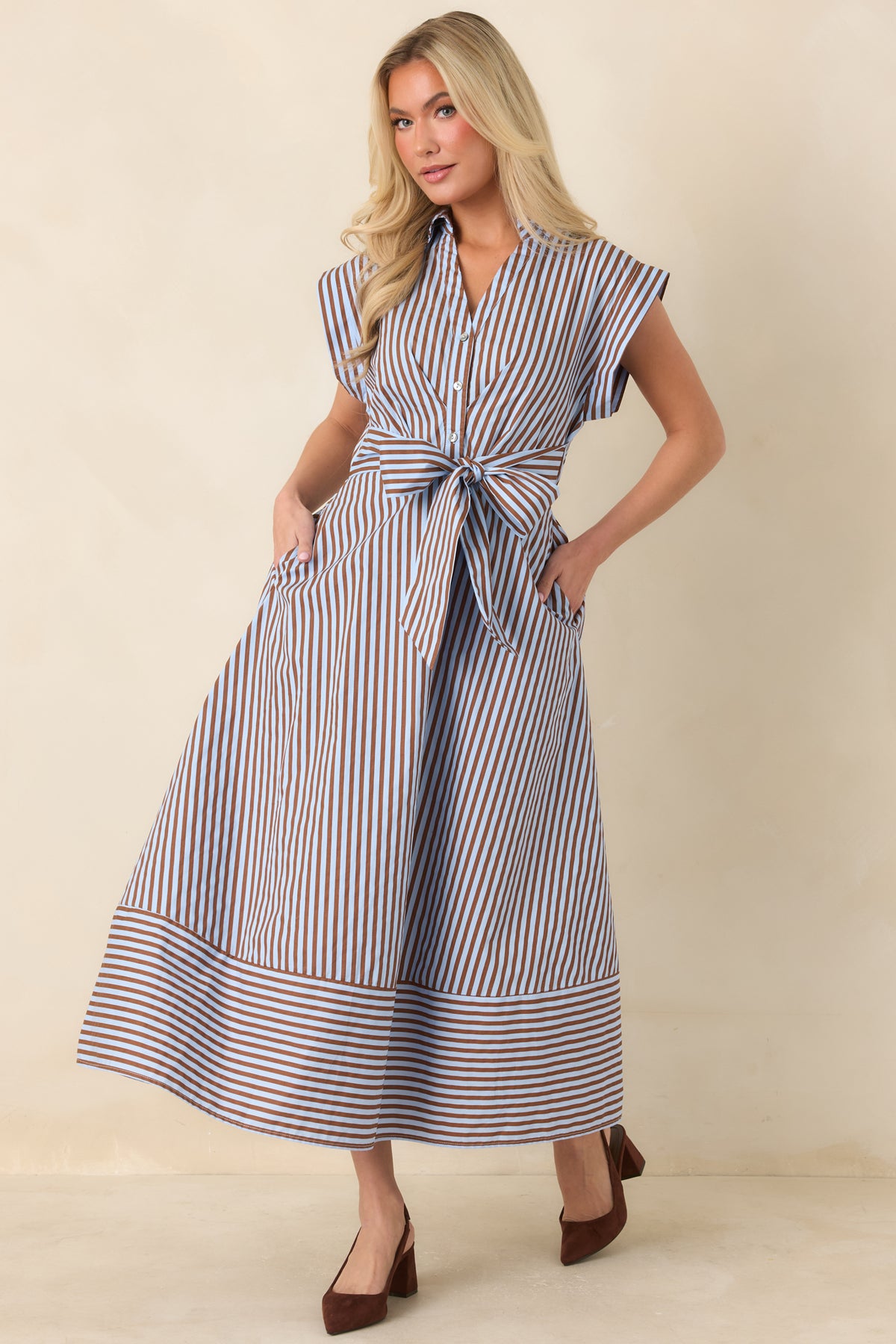 Light blue and brown striped midi dress with tailored cap sleeves, side ties, and a classic collared bodice.