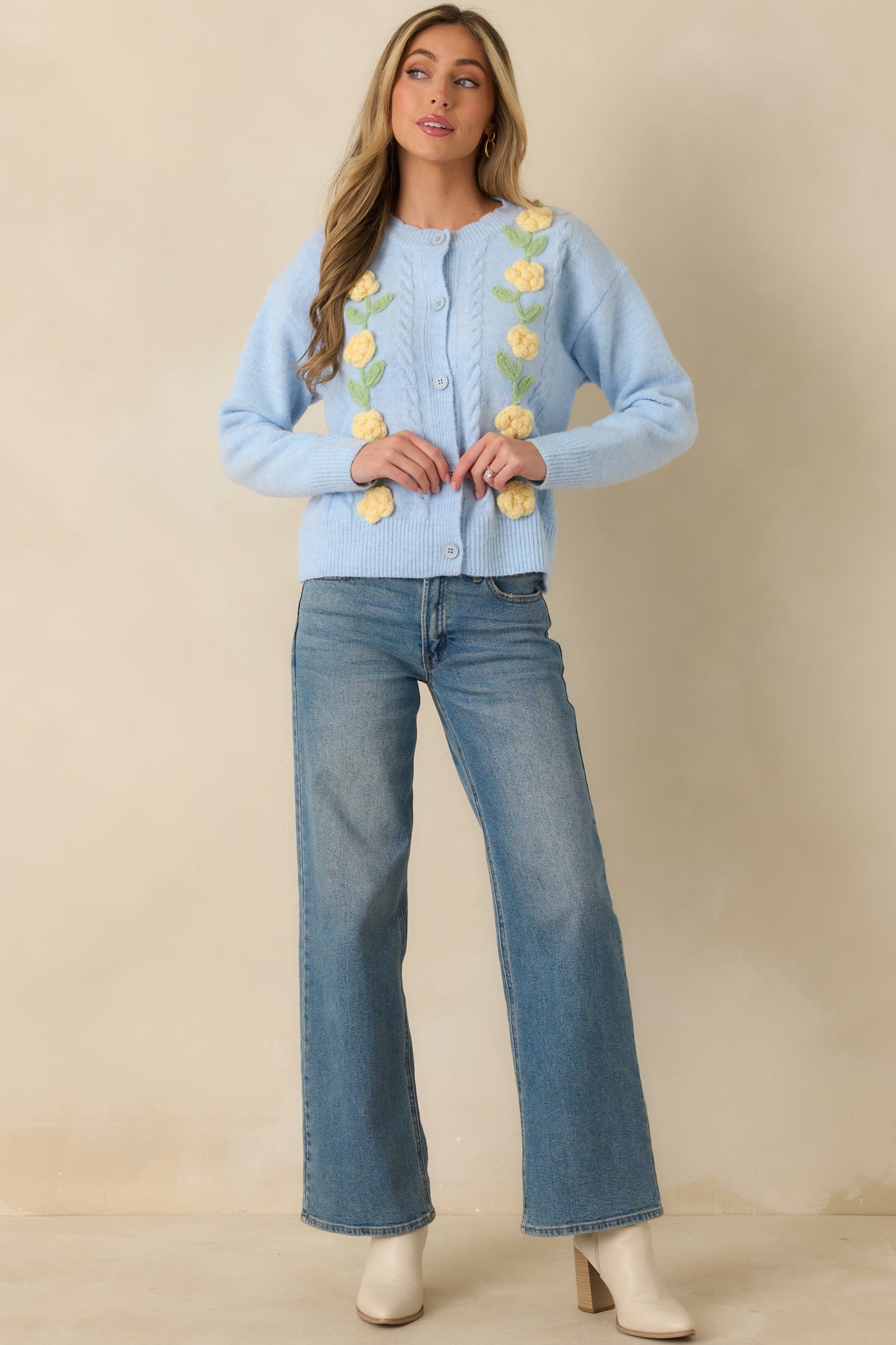 Light blue cardigan styled front-facing, showing true-to-size fit and structured ribbed trim.