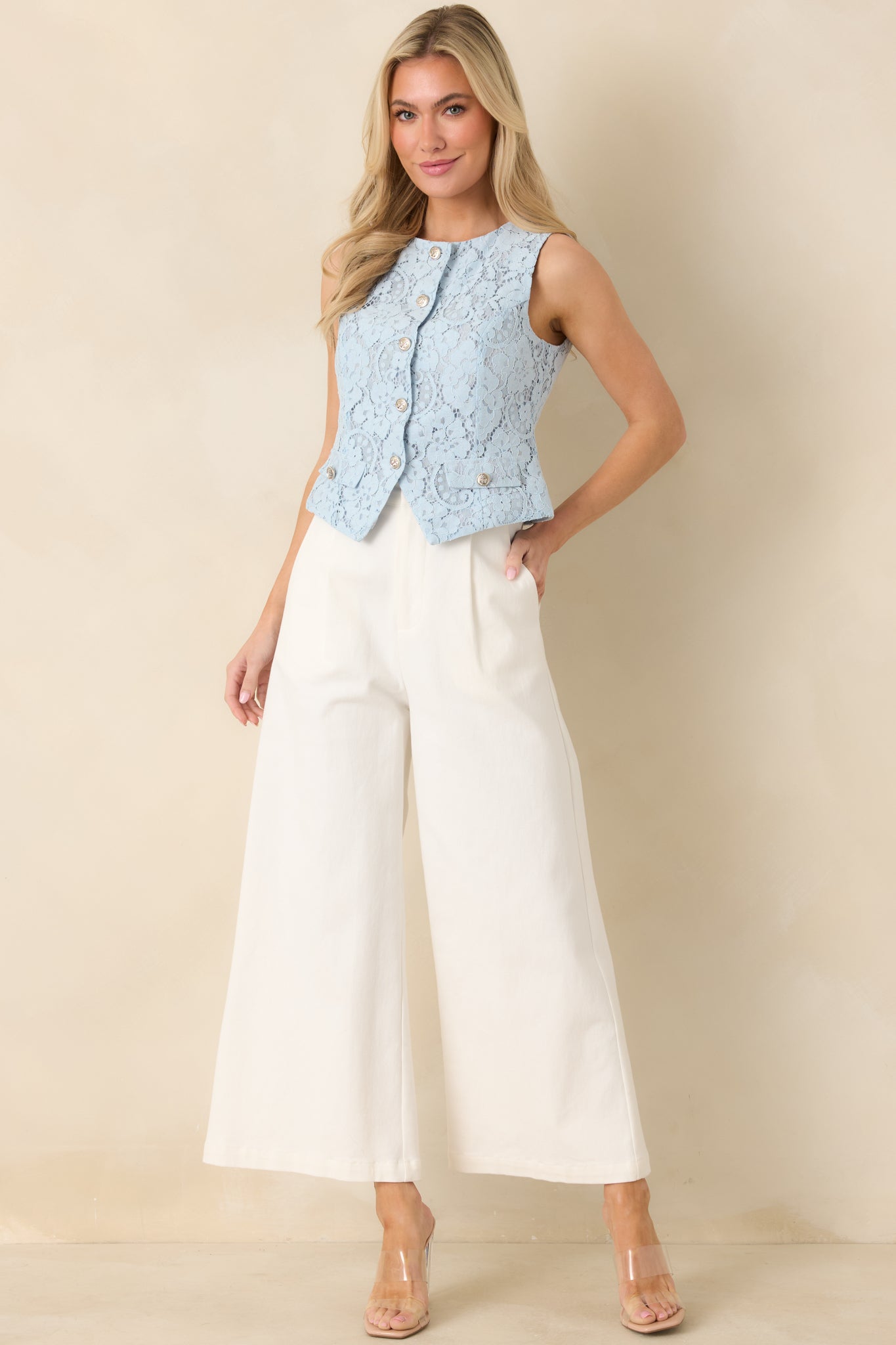 Guipure vest in light blue featuring smooth underlining, faux front pockets, and clean tailored fit.