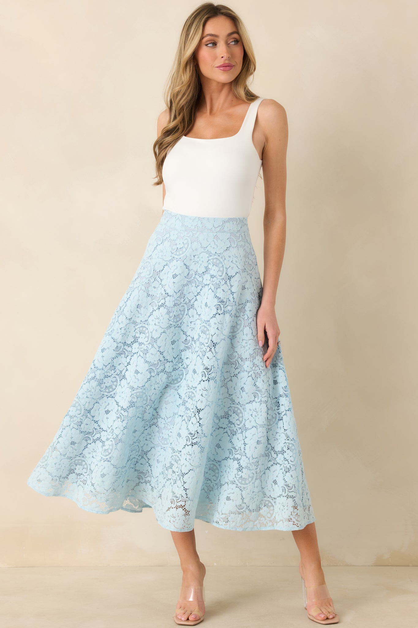Light blue lace skirt featuring intricate guipure design and softly structured flare.