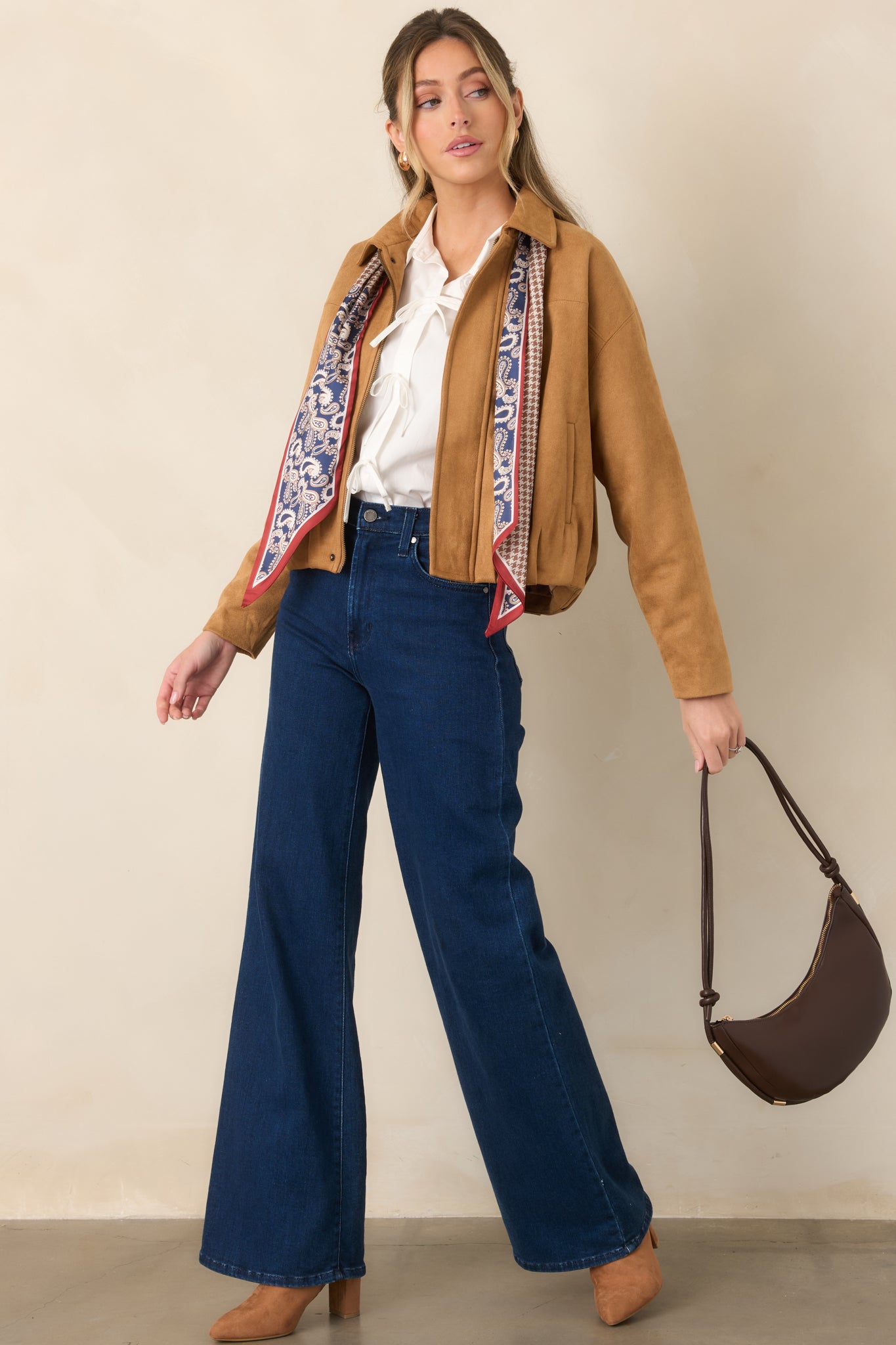 Light golden brown faux suede ankle boots with pointed toes, sleek ankle-height shafts, outer seam detailing, and block heels.
