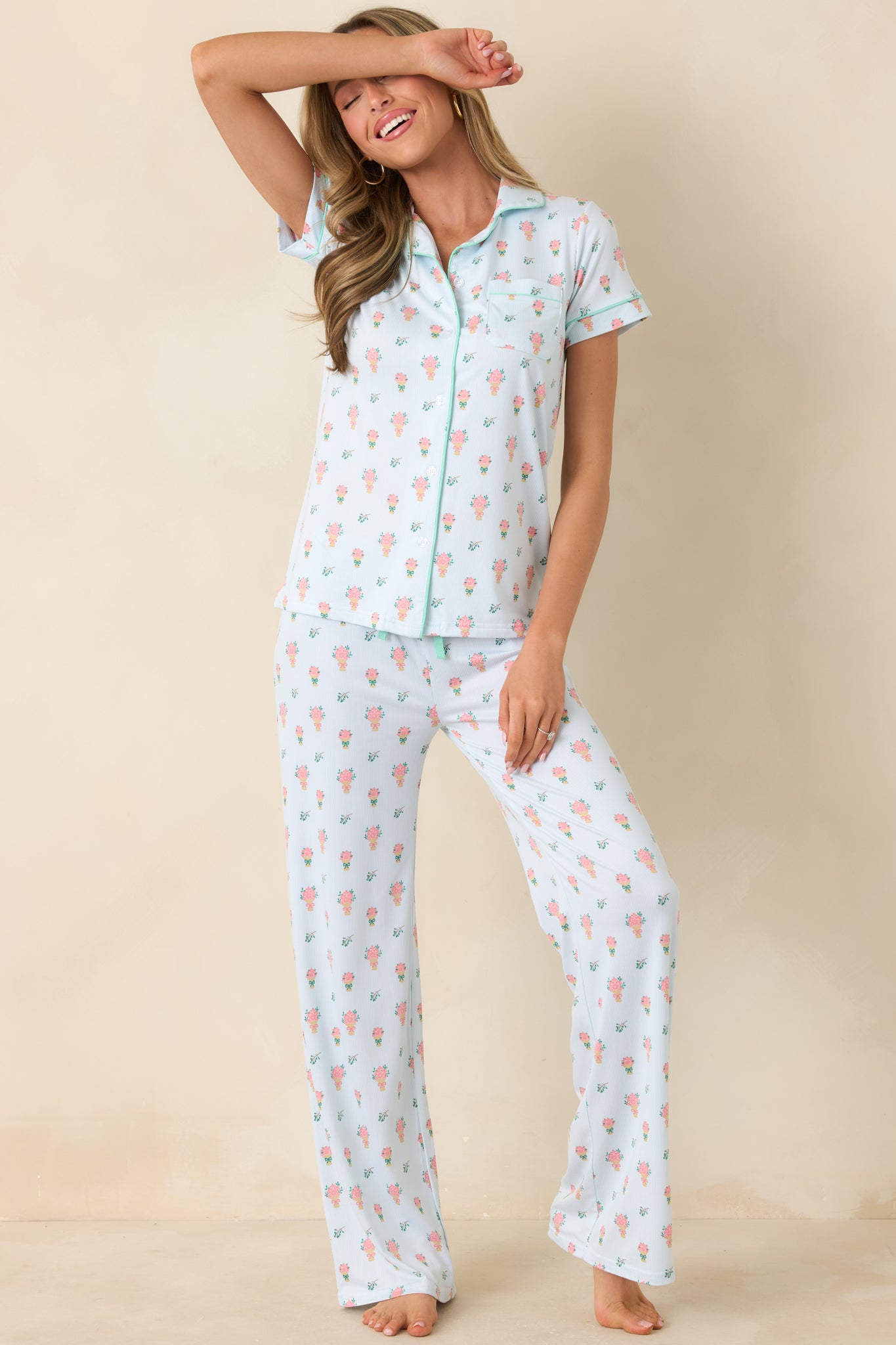 Light green button-front top with an allover petite floral bouquet print and delicate contrast piping for a polished finish.