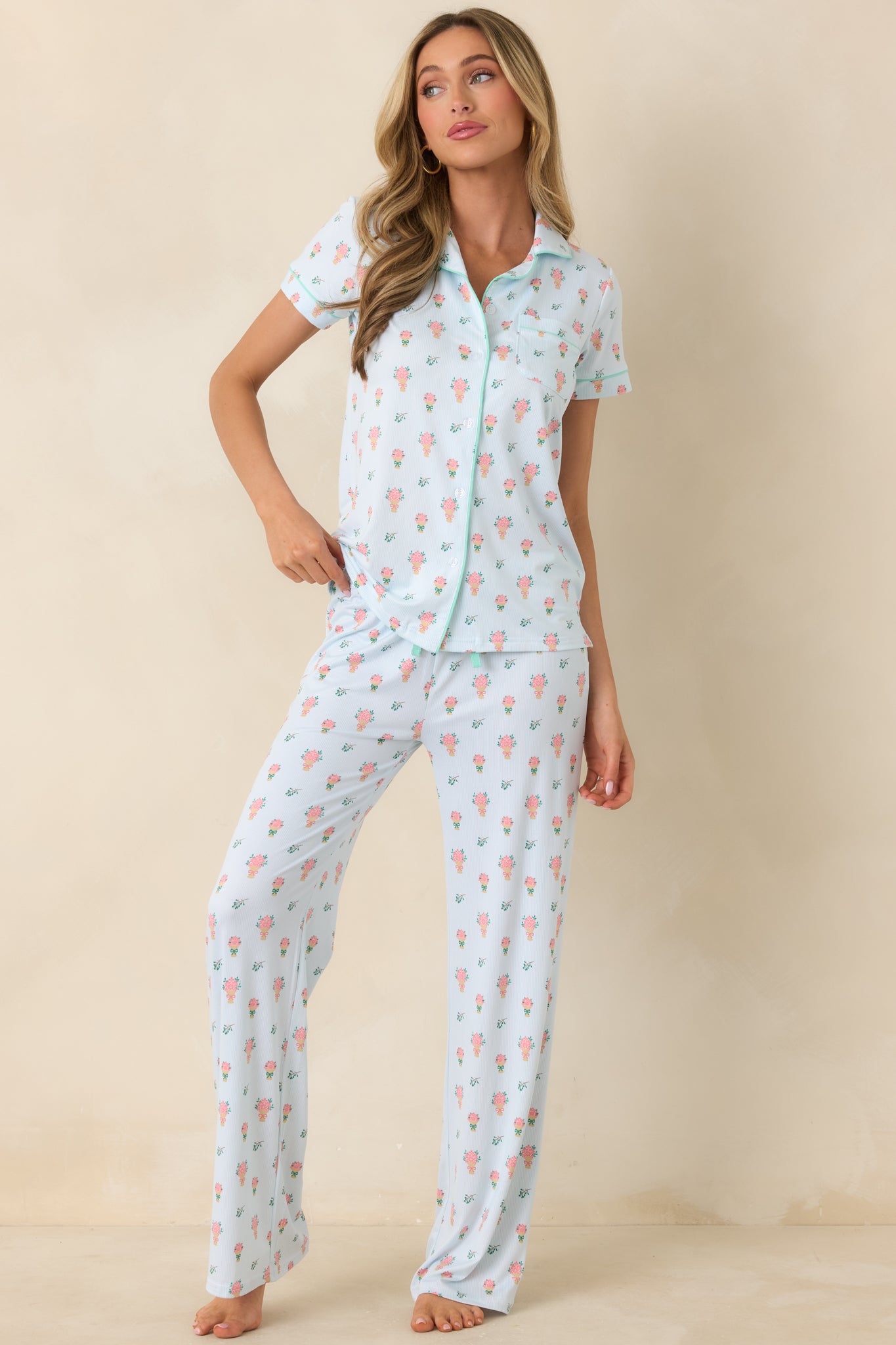 Light green floral button-down top designed with crisp contrast piping and a smooth, streamlined silhouette.