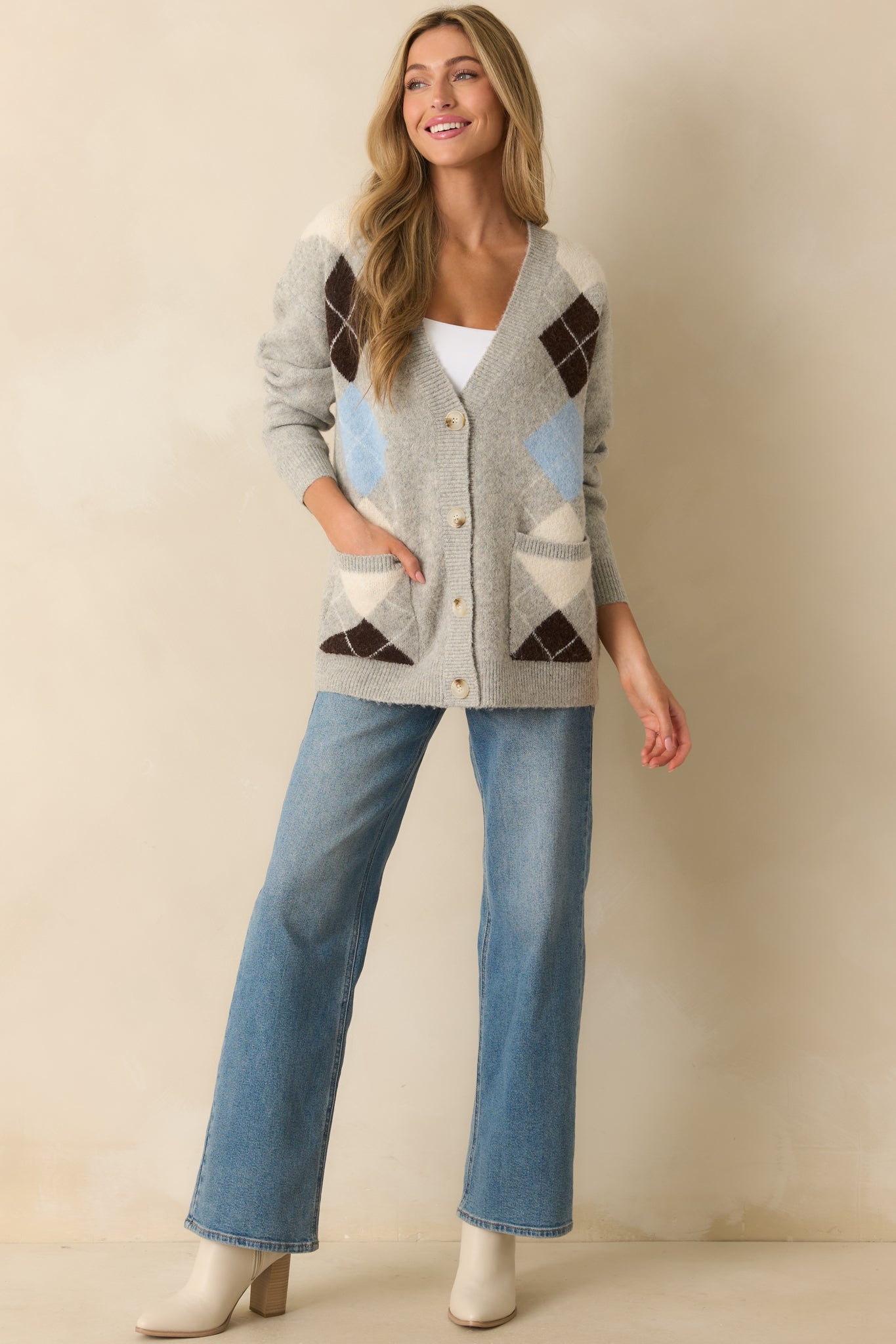 A straight-on front view highlighting the functional button front closure and front patch pockets.