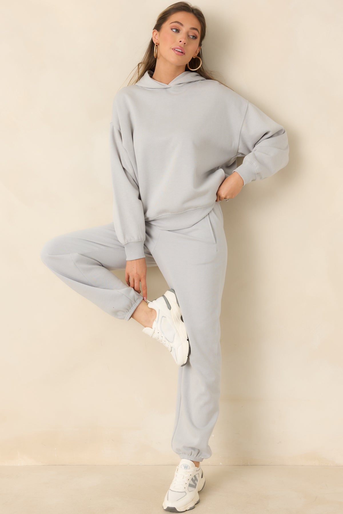 Light grey cotton-blend hoodie featuring a relaxed silhouette, ribbed cuffs, and a ribbed hem.
