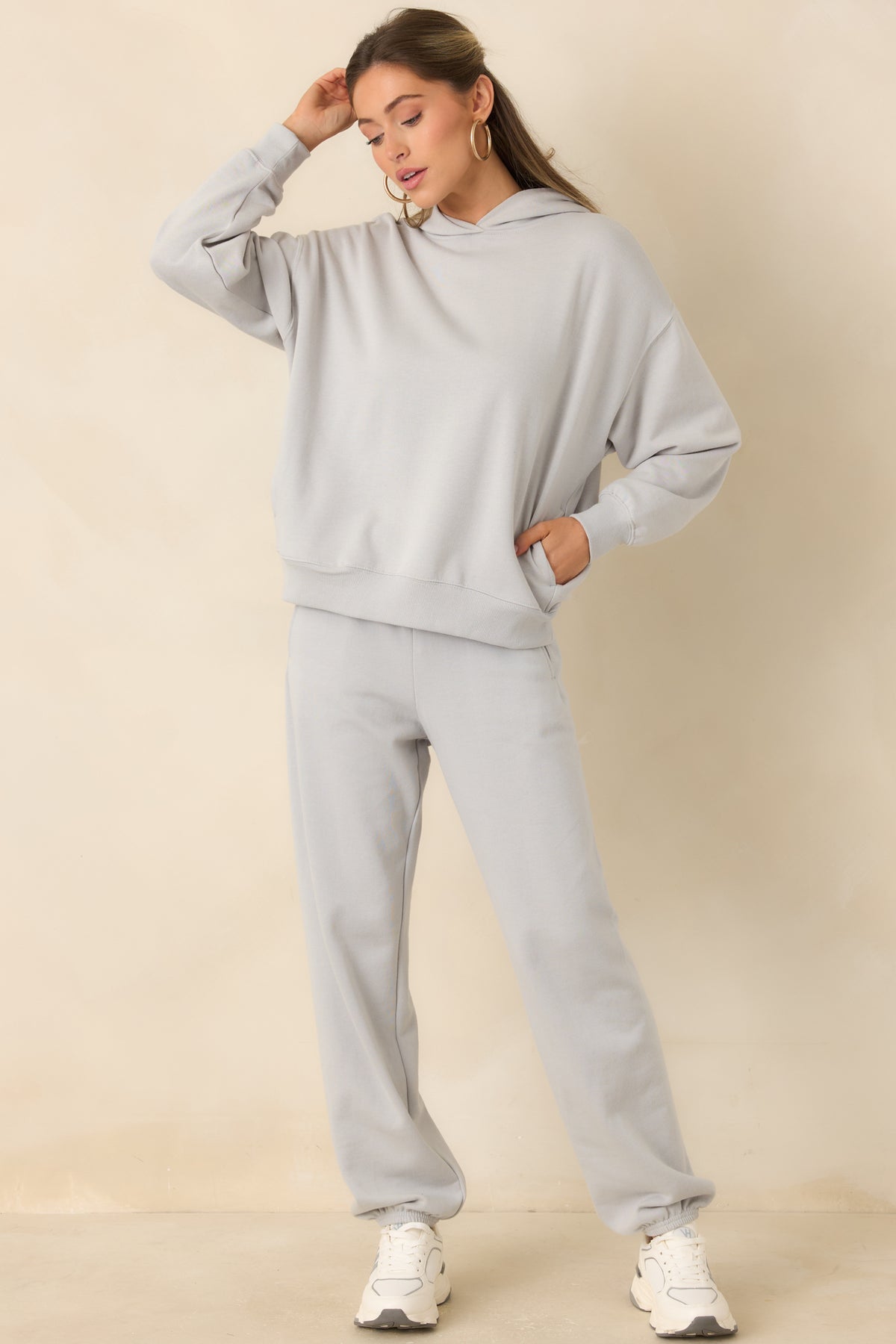 Light grey cotton-blend joggers featuring a relaxed fit and elasticized ankle cuffs.
