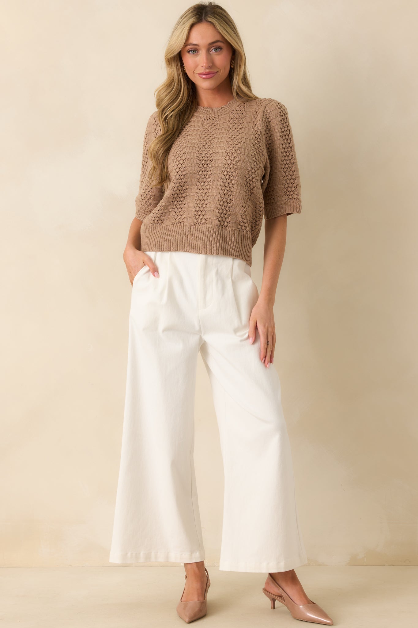 Light mocha short-sleeve sweater shown front facing, highlighting the crew neckline and alternating crochet and ribbed panels.