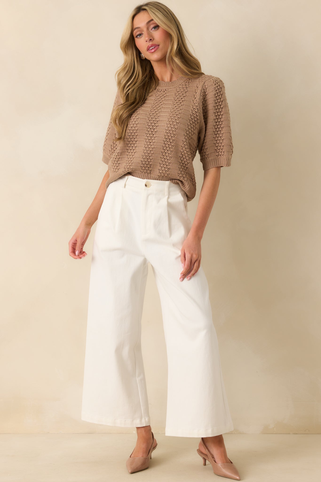Light mocha sweater shown front facing, highlighting the short sleeves and ribbed knit panels.