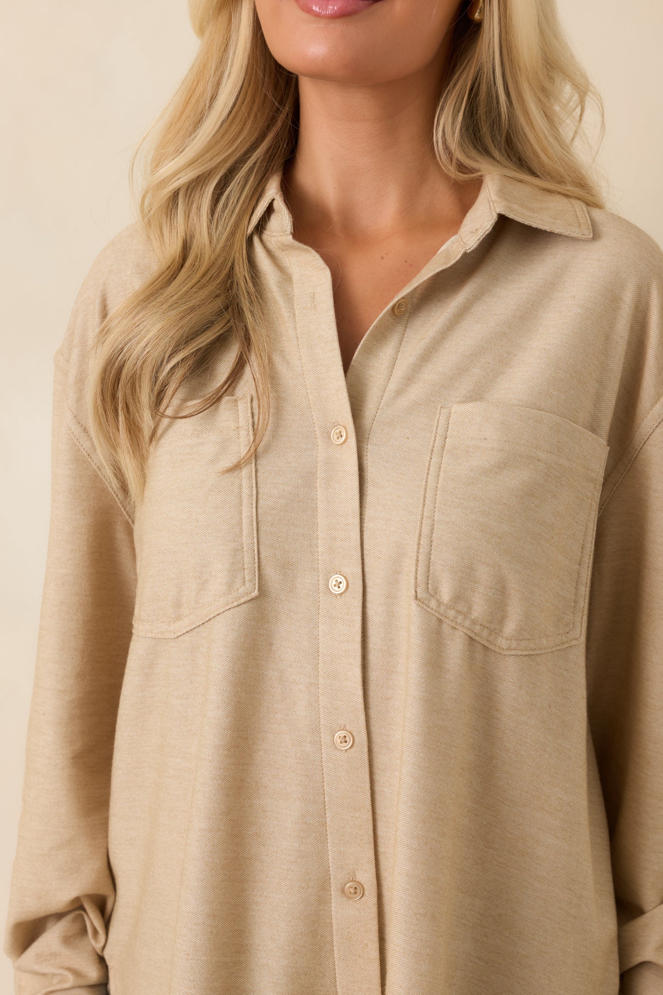 Detailed view of the light toffee top highlighting the collar, buttons, and cotton-blend fabric texture.