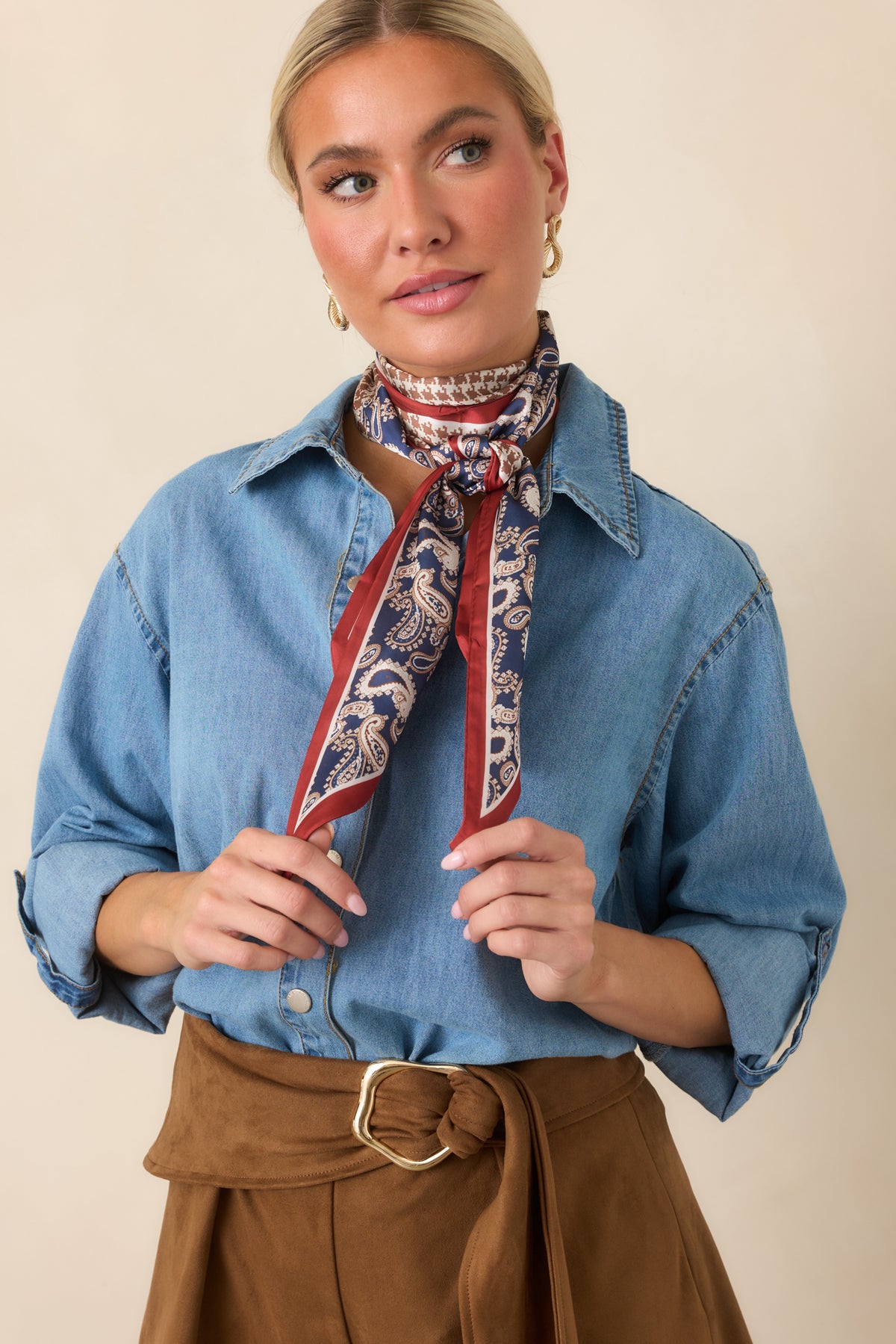 Collared neckline and button-front closure give the light-wash cotton top a timeless finish.