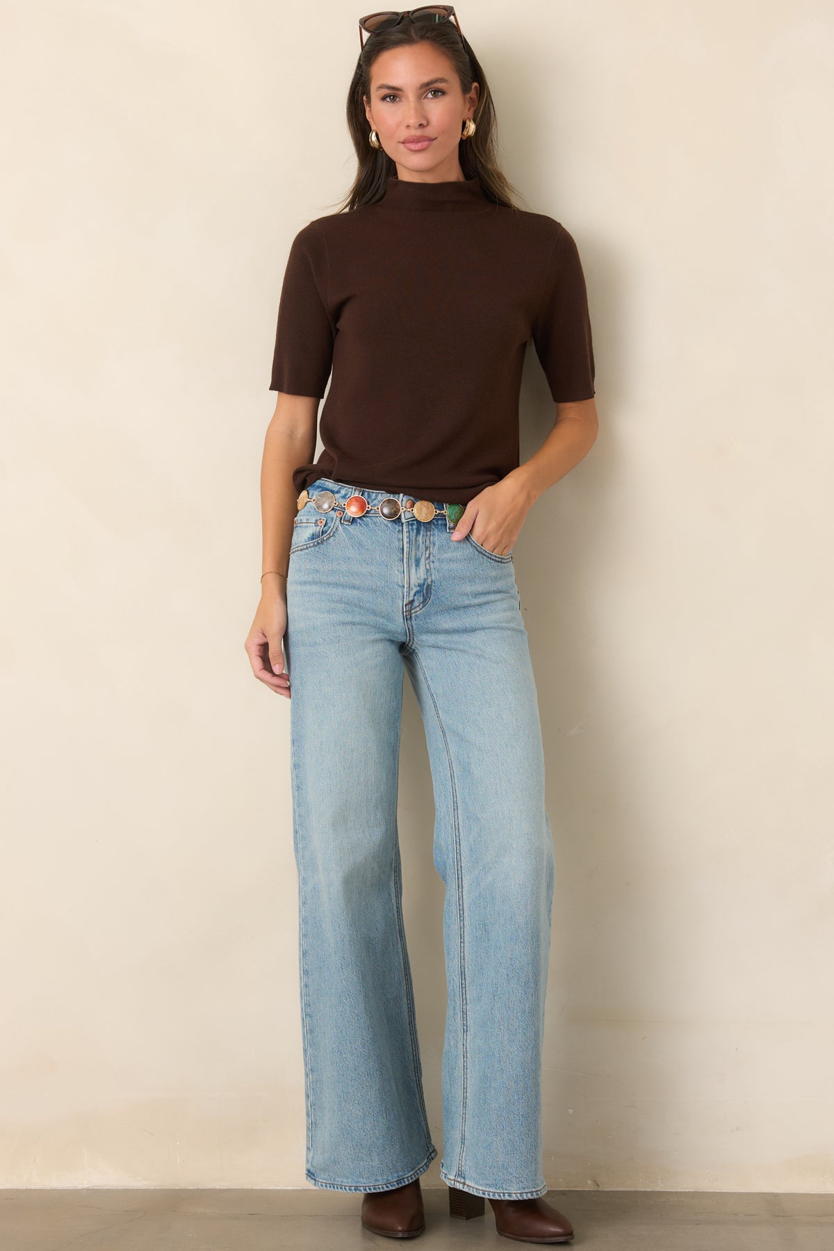 Vintage-inspired light wash jeans with a mid-rise waist, full-length wide legs, subtle whiskering, and allover fading.