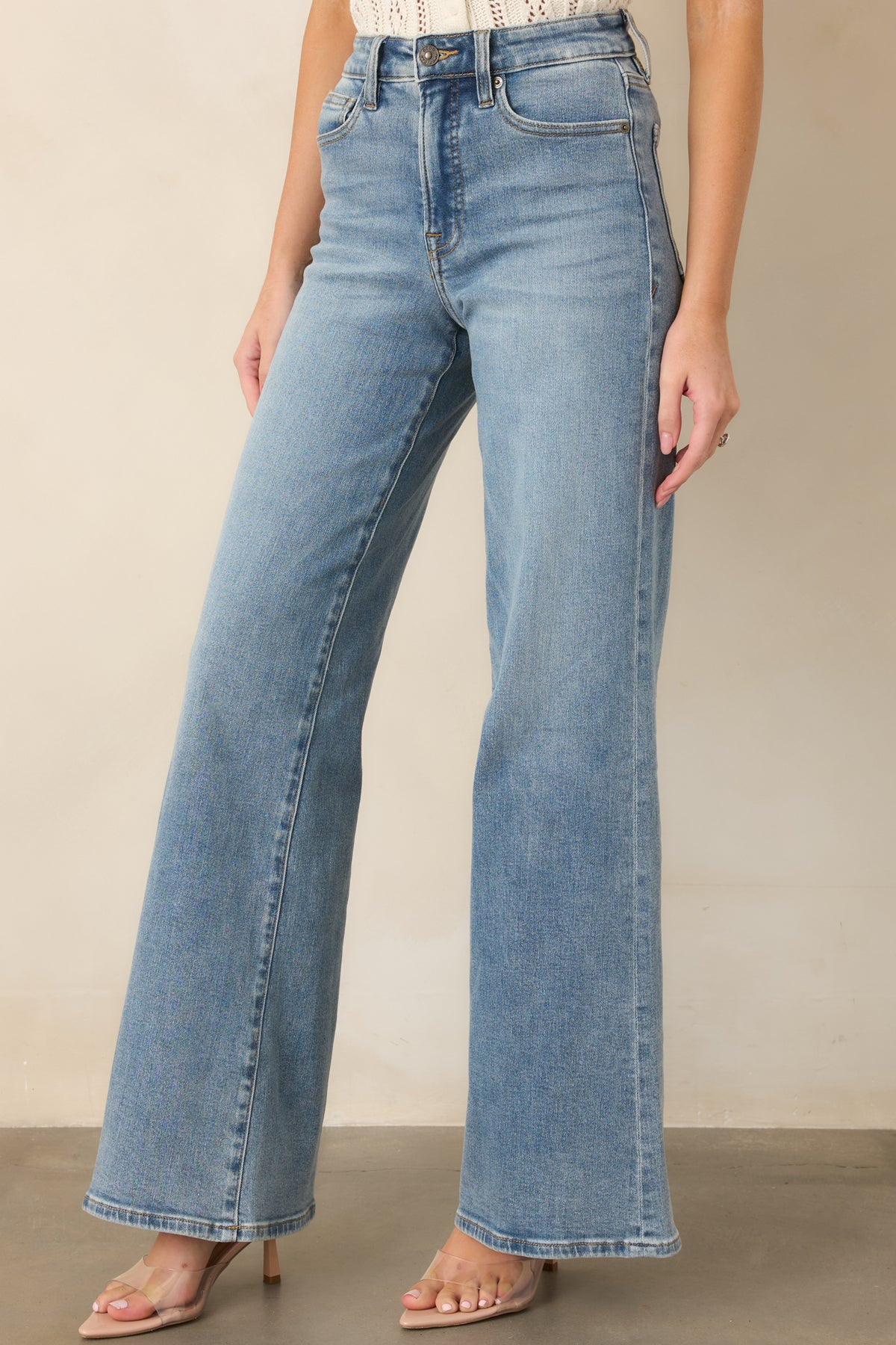 Light wash pants showcasing the flattering high-rise waist and streamlined shape.