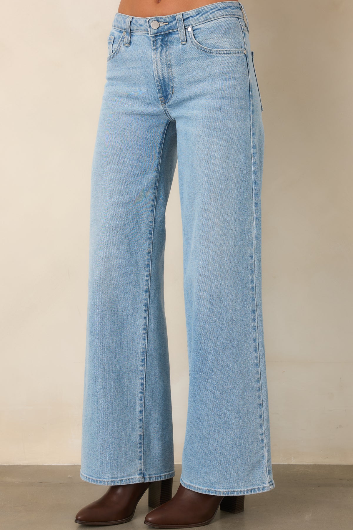 The relaxed wide leg silhouette gives these light wash pants a fluid, easygoing appearance.