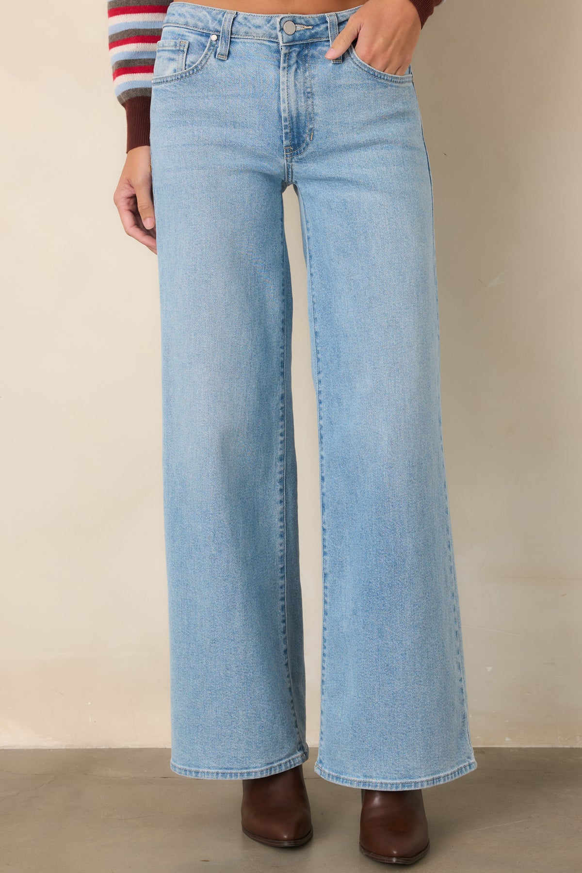 Light wash fabric highlights the relaxed construction and generously cut wide leg silhouette.
