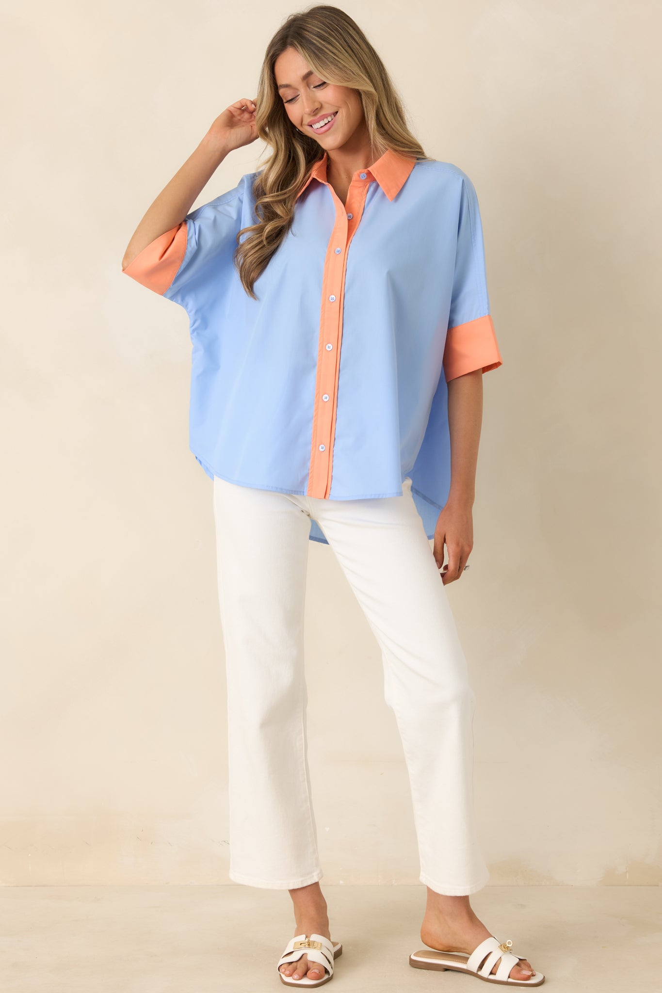 Lightweight button-front top, with a relaxed silhouette and bold contrast collar, placket, and cuffs.