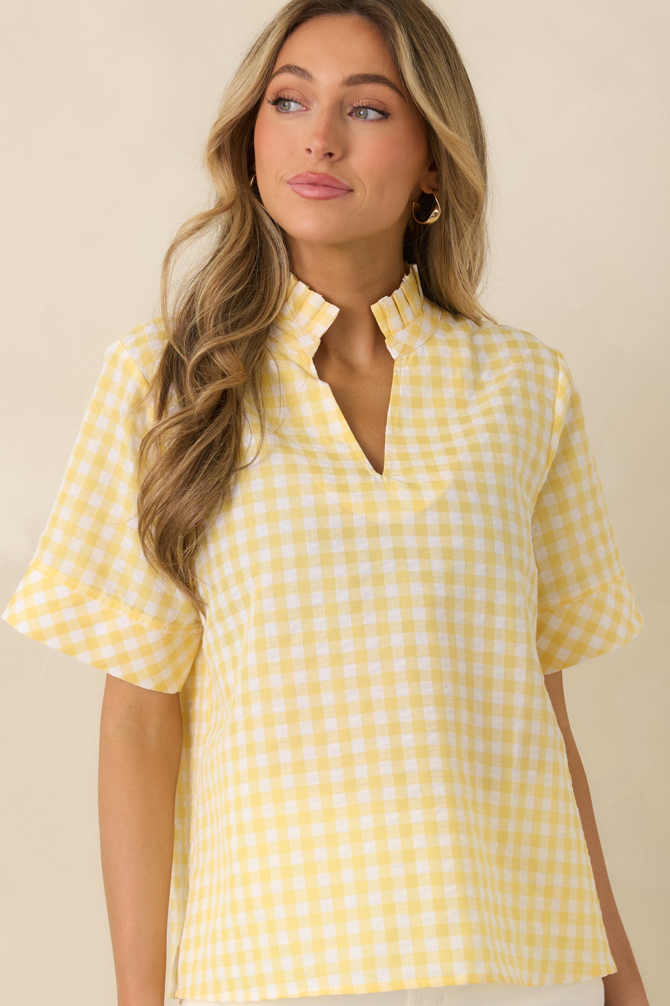 Lightweight cotton top highlighting split V-neck and relaxed fit.