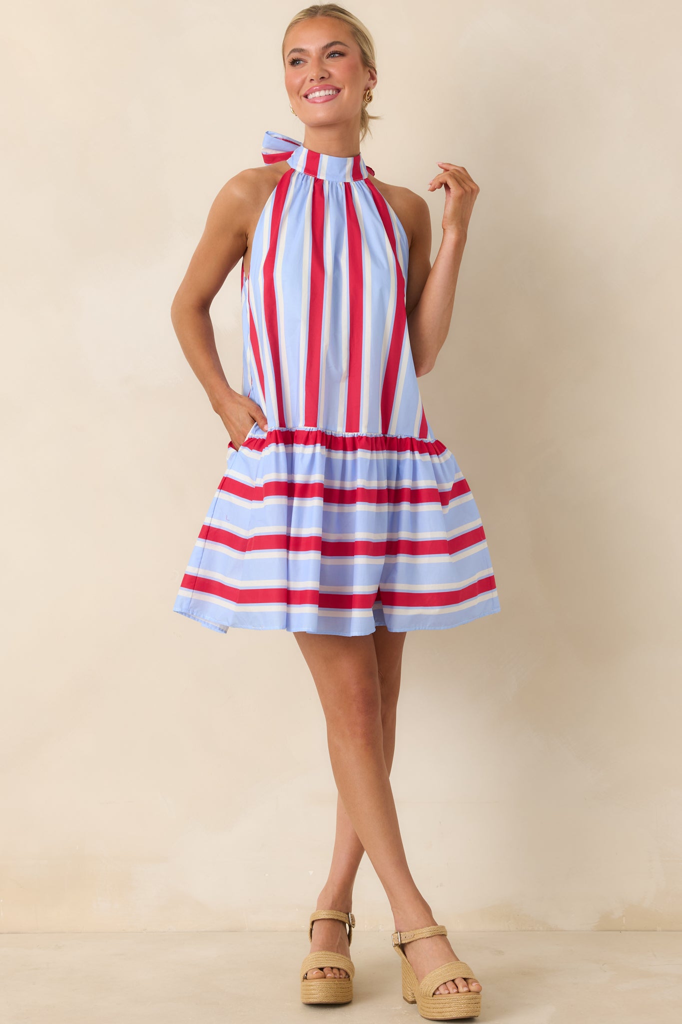 Lightweight halter mini dress with tiered skirt and relaxed, easy-fit design.