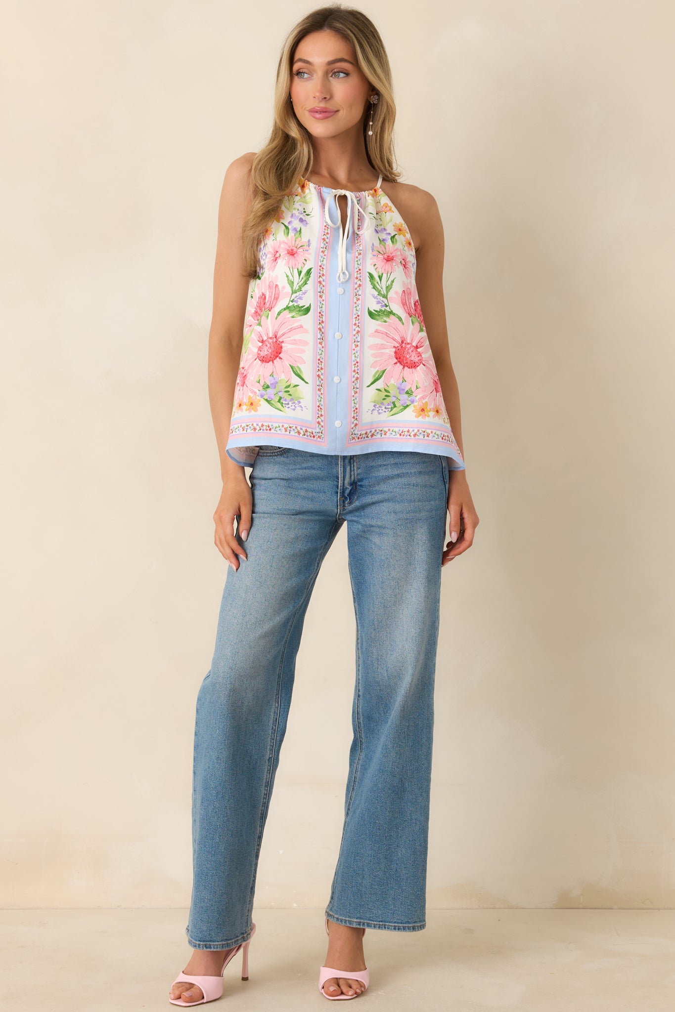 Lightweight ivory halter top with adjustable tie-front and easy drape.
