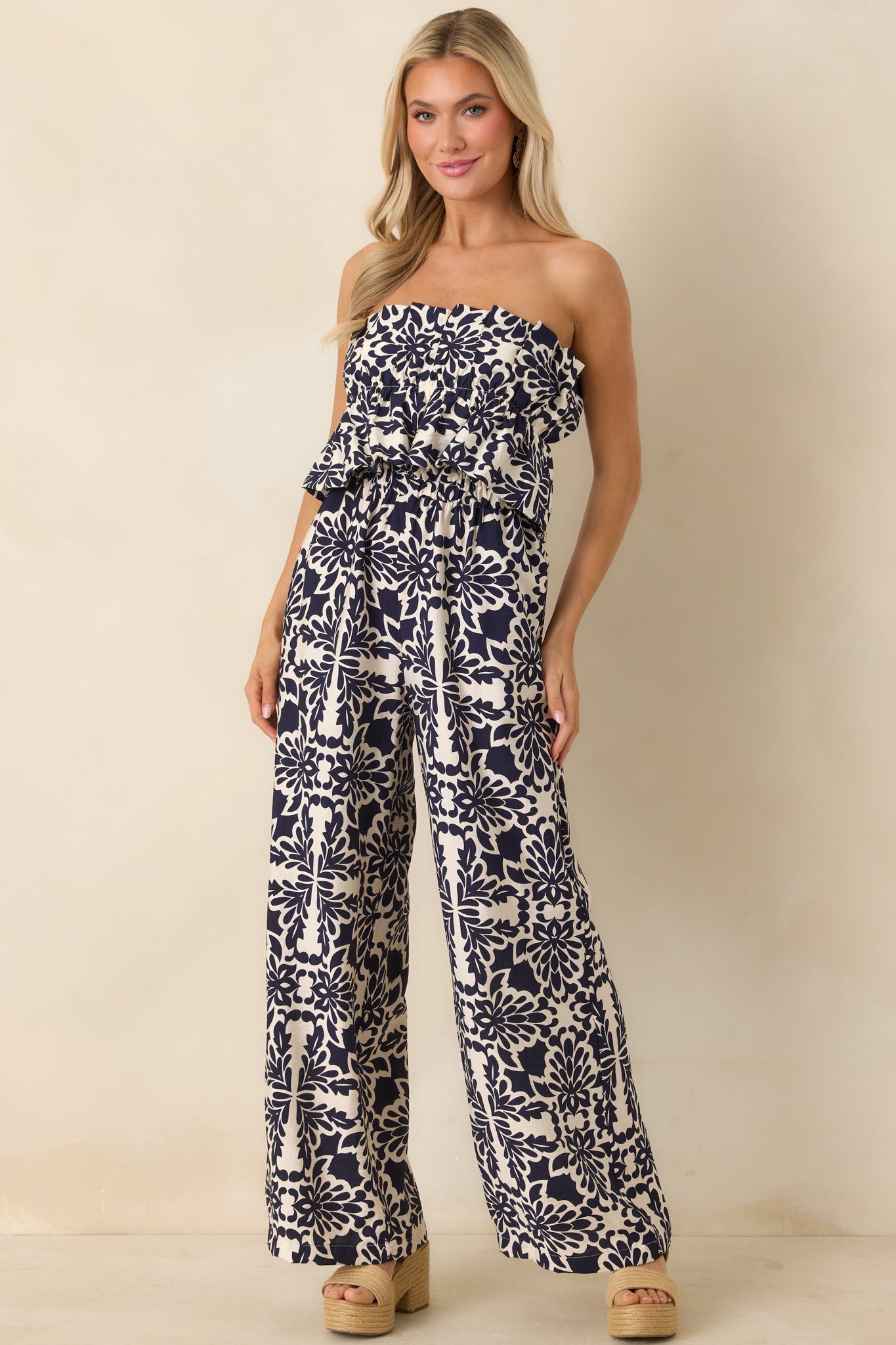 Lightweight jumpsuit featuring wide leg silhouette and flowy fit.