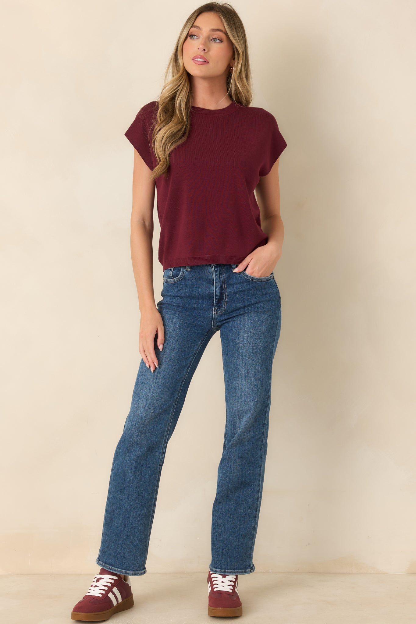 Lightweight knit sweater featuring a classic crew neckline, short relaxed sleeves, straight silhouette, and ribbed trim at the neckline and hem.