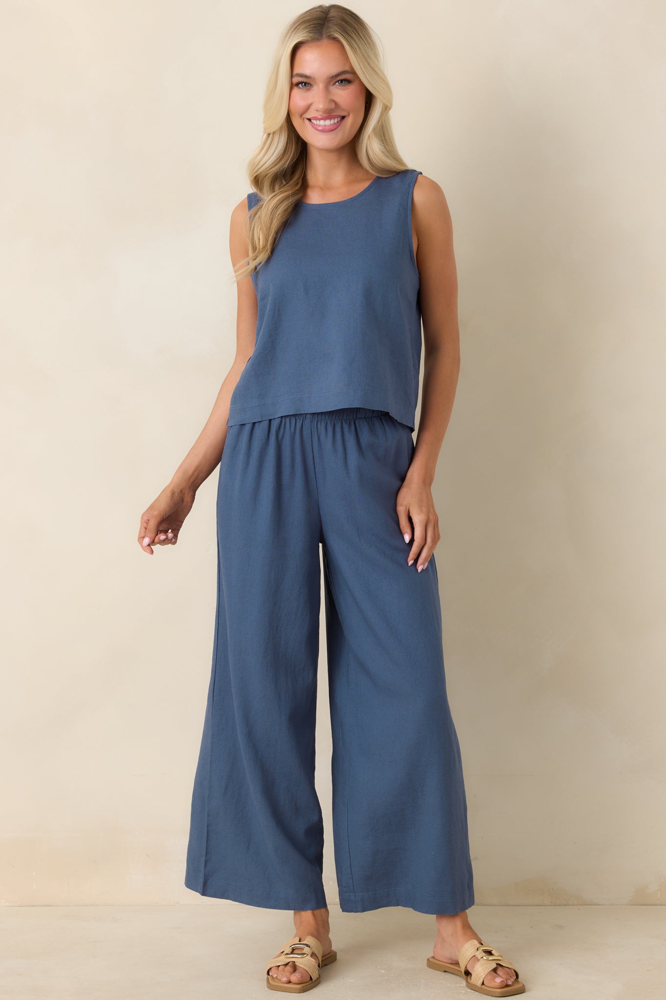 Lightweight linen blend pants in indigo featuring wide-leg shape, high-rise waist, and easy drape.