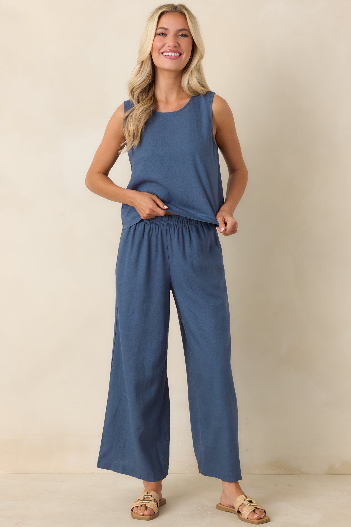 Lightweight linen blend top with boxy silhouette, crew neckline, and slightly cropped length.