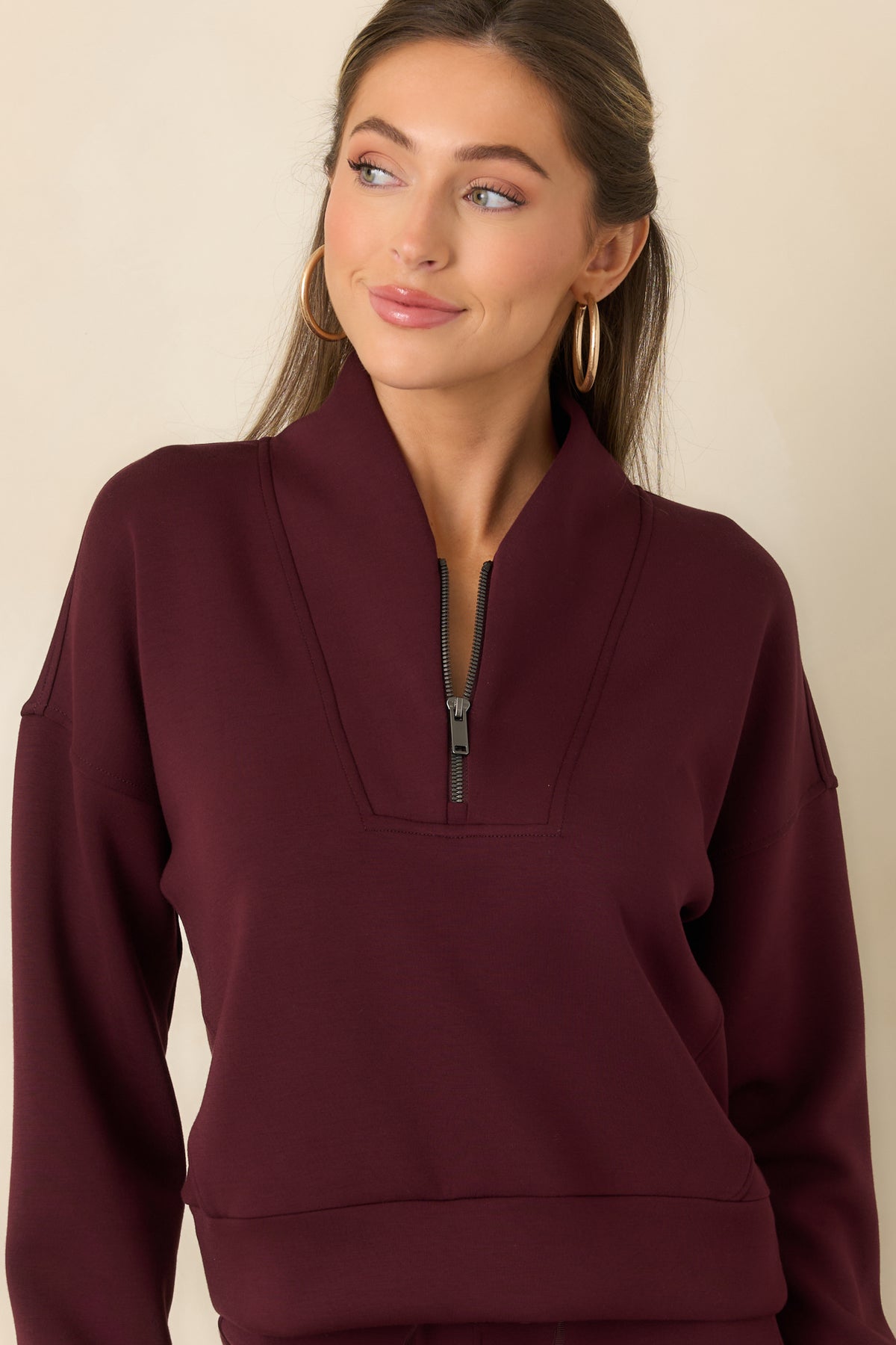 Long sleeves and coordinating cuffs on the lightweight spacer-fabric top.
