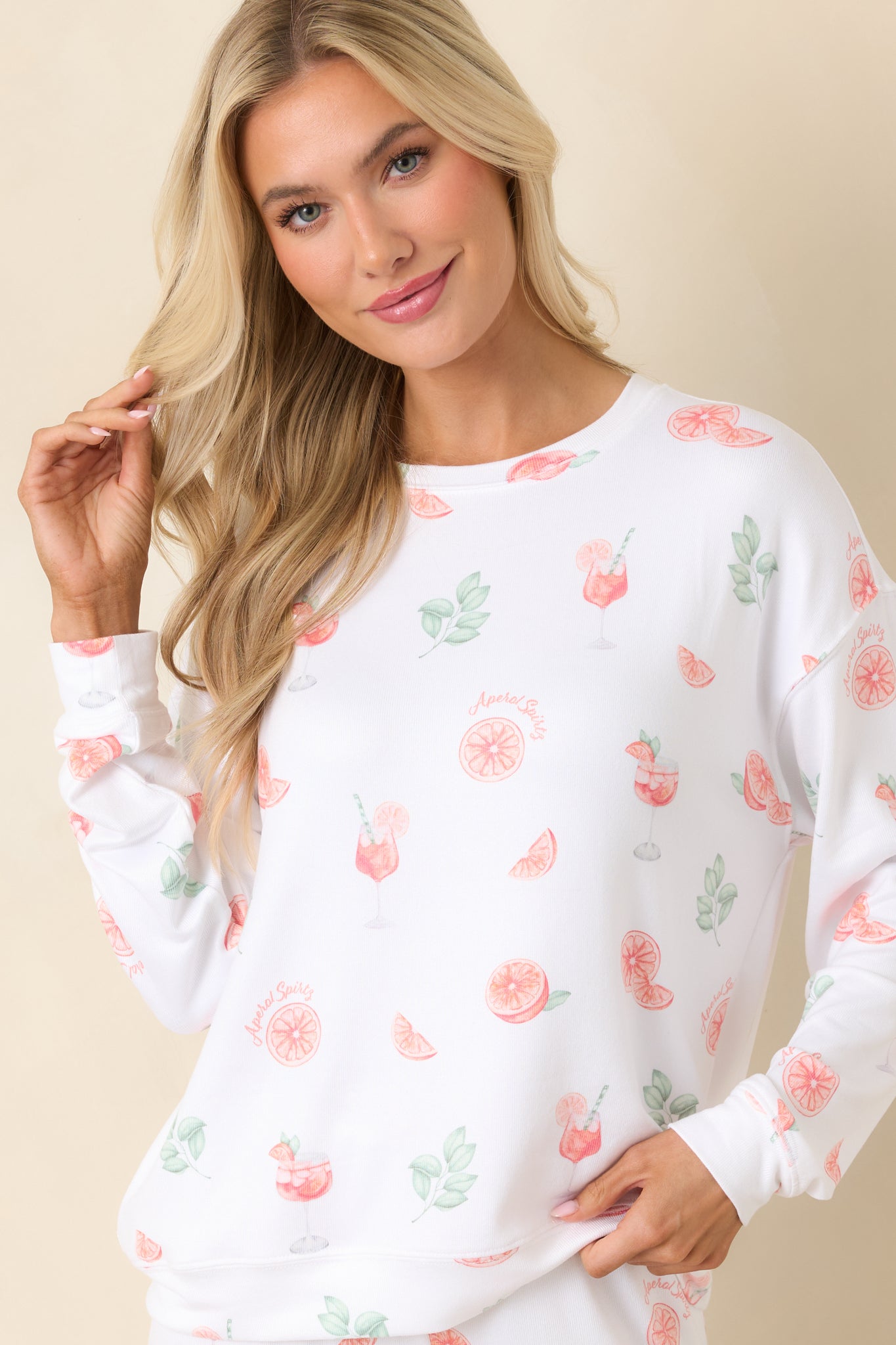 Lightweight long sleeve top with colorful citrus pattern and relaxed structure.