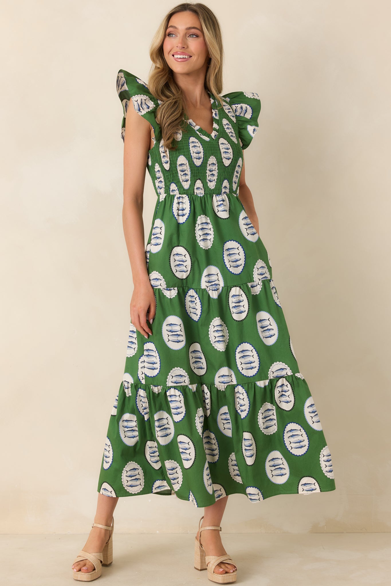 Lightweight maxi dress with fish medallion pattern, smocked waist, and breezy short sleeve design