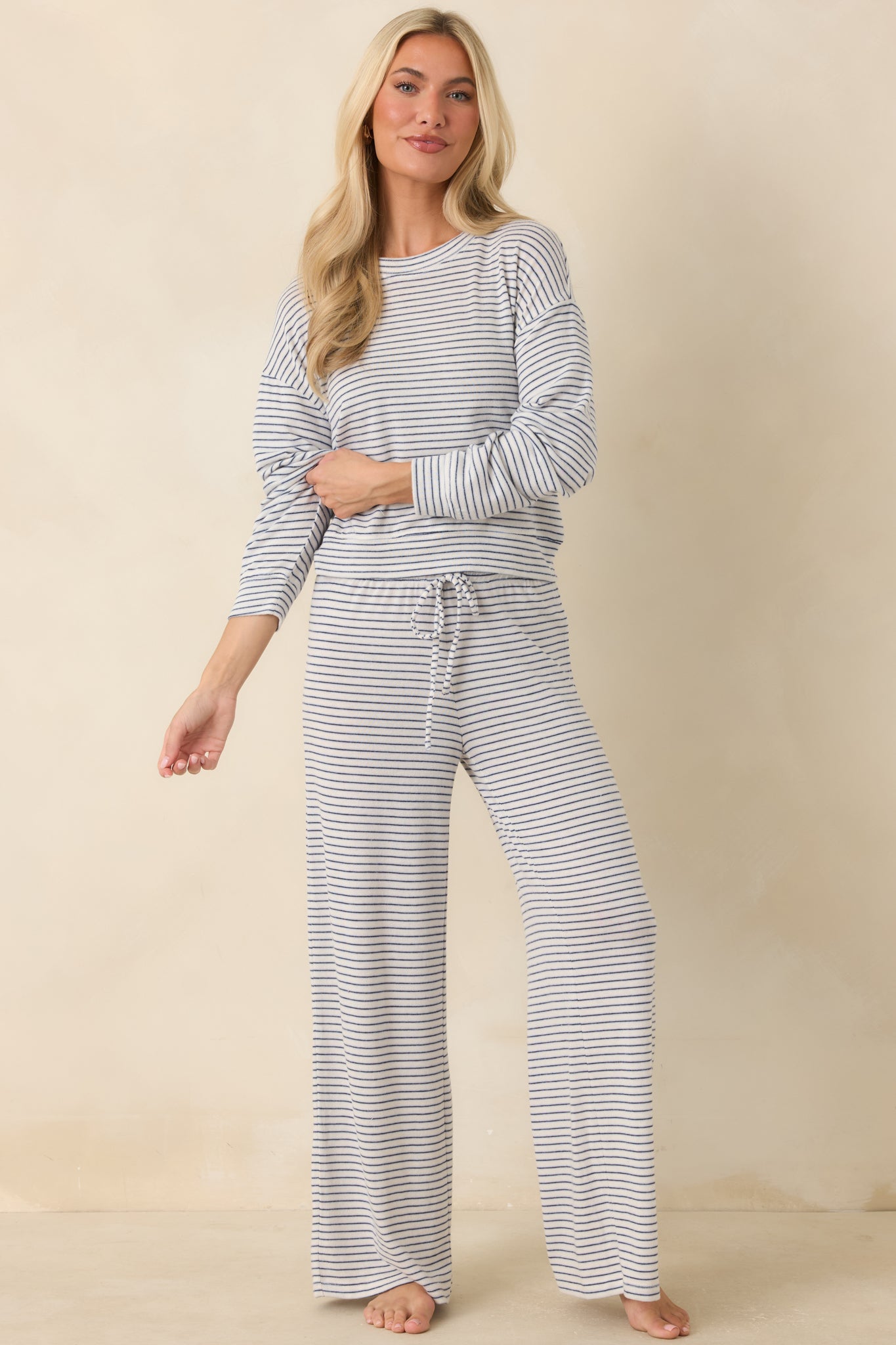 Lightweight navy stripe pullover designed with a relaxed shape and comfortable long sleeve construction.
