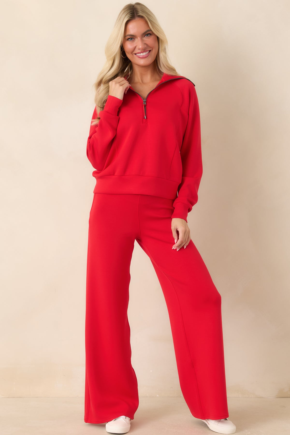 Lightweight red pants showcasing a relaxed fit, adjustable drawstring waistband, clean seaming, and flowing wide legs.