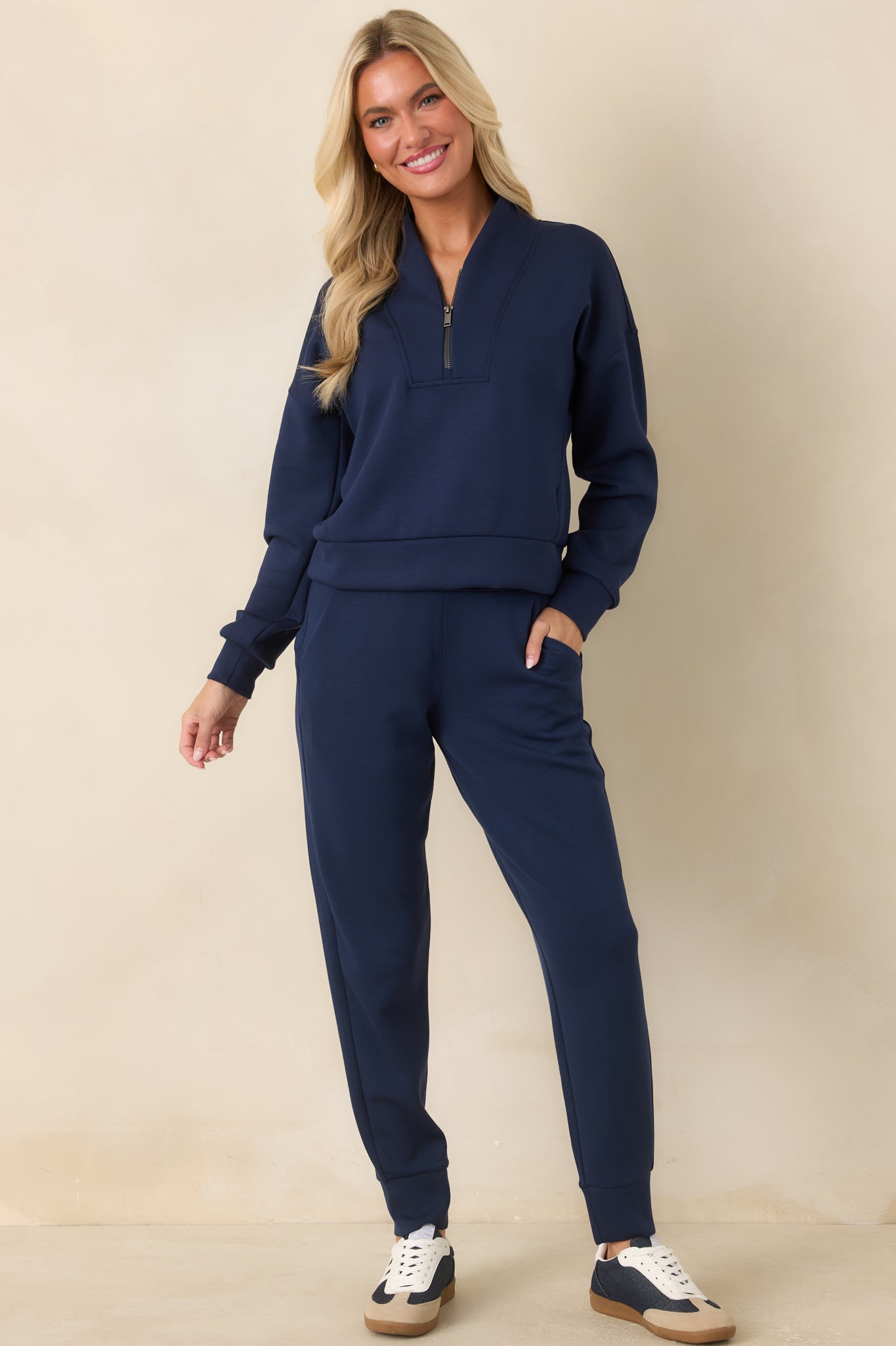 Lightweight spacer fabric pullover featuring a sculptural shawl collar, half-zip neckline, relaxed silhouette, and wide banded hem for a clean, polished finish.