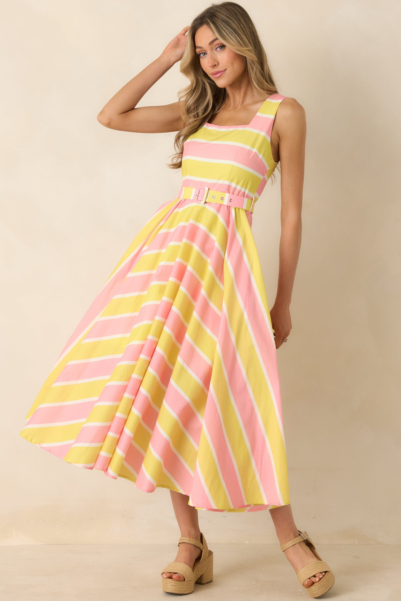 Lightweight striped midi dress with square neckline, and flowing skirt.