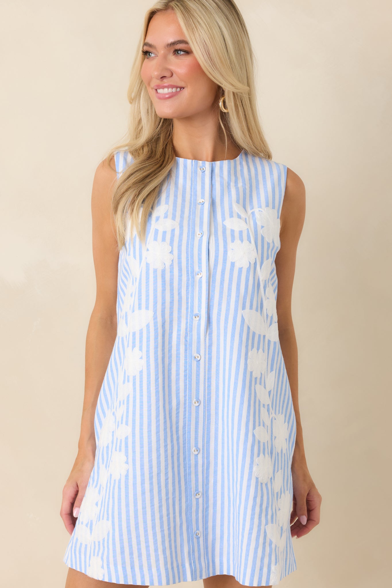Lightweight mini dress showcasing vertical stripes, refined details, and an effortlessly polished silhouette.