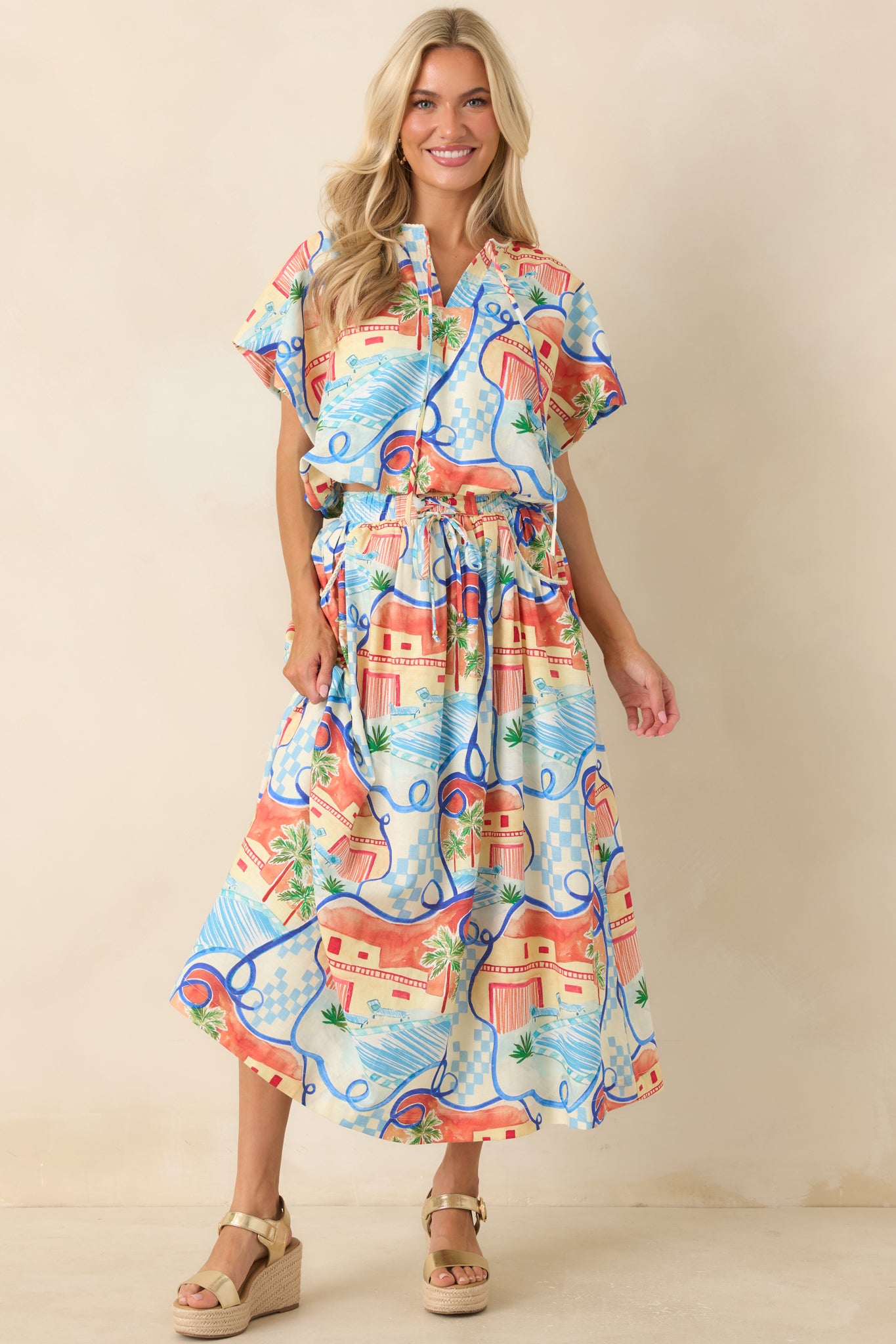 Lightweight vacation-inspired top showcasing a split neckline with adjustable ties and a flowing easy drape.
