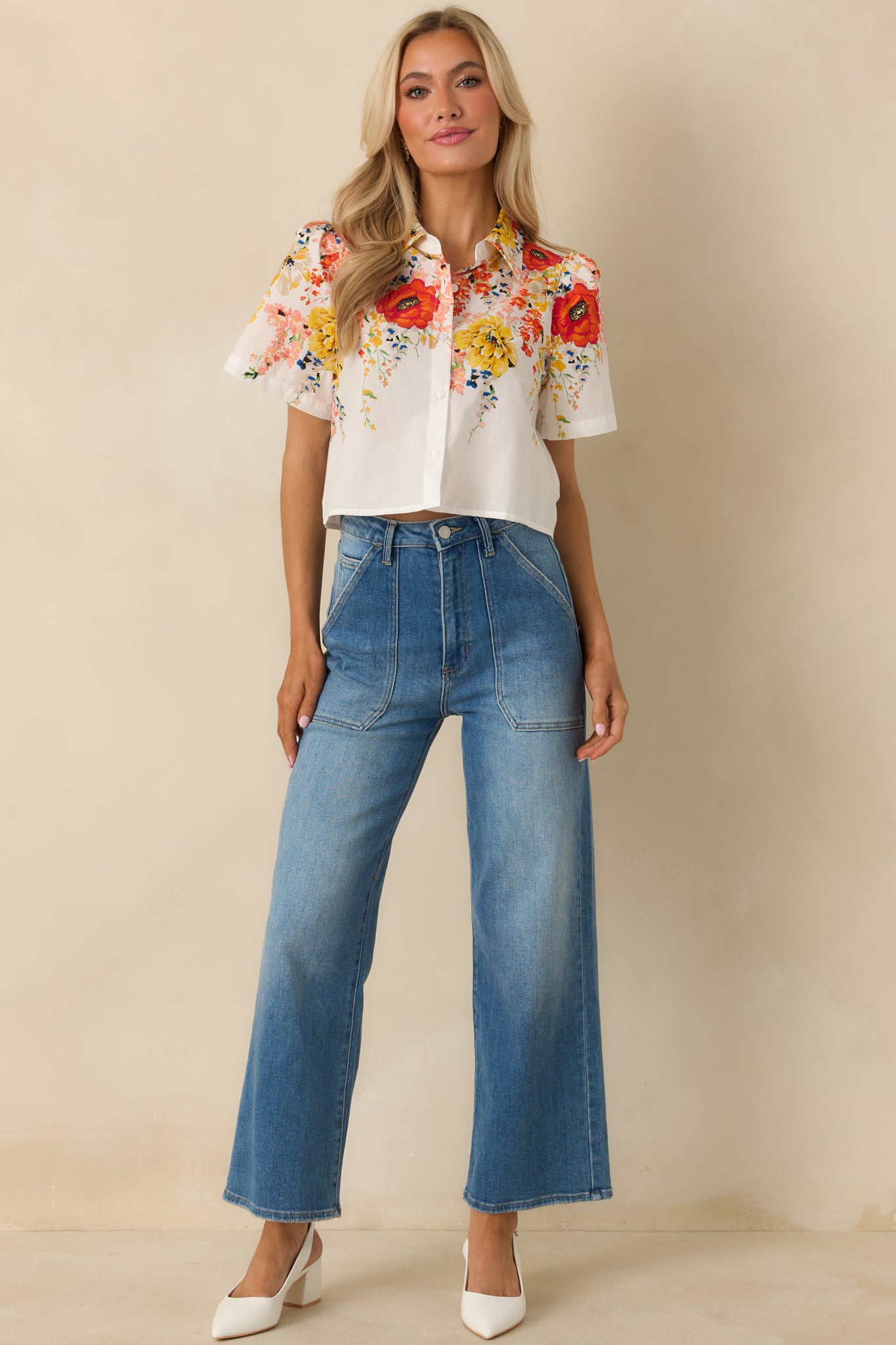 Lightweight white floral top featuring a structured collar, easy button-front closure, and breathable cotton fabric.