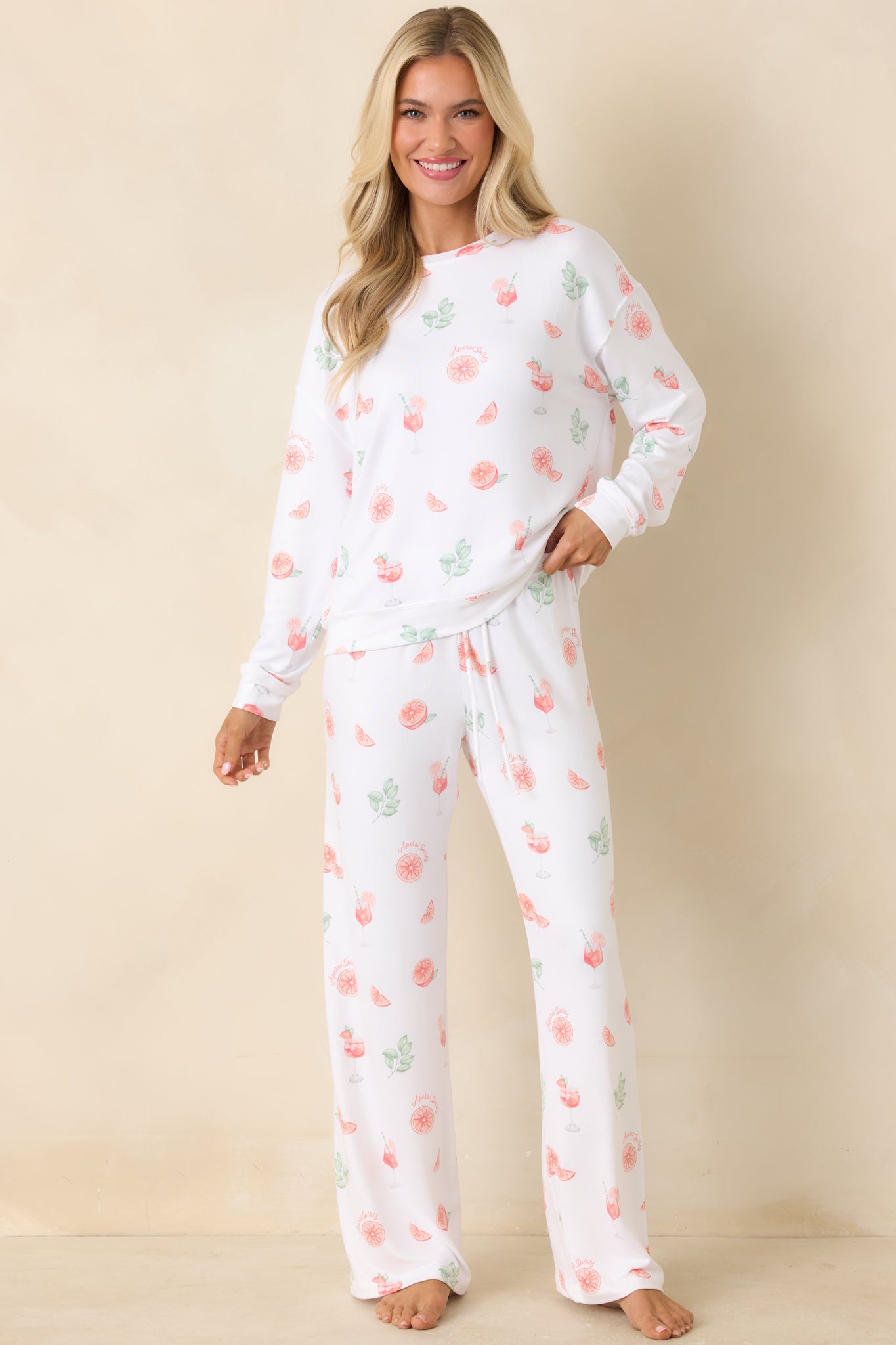 Lightweight white pajama top featuring colorful citrus drink print and crew neckline.