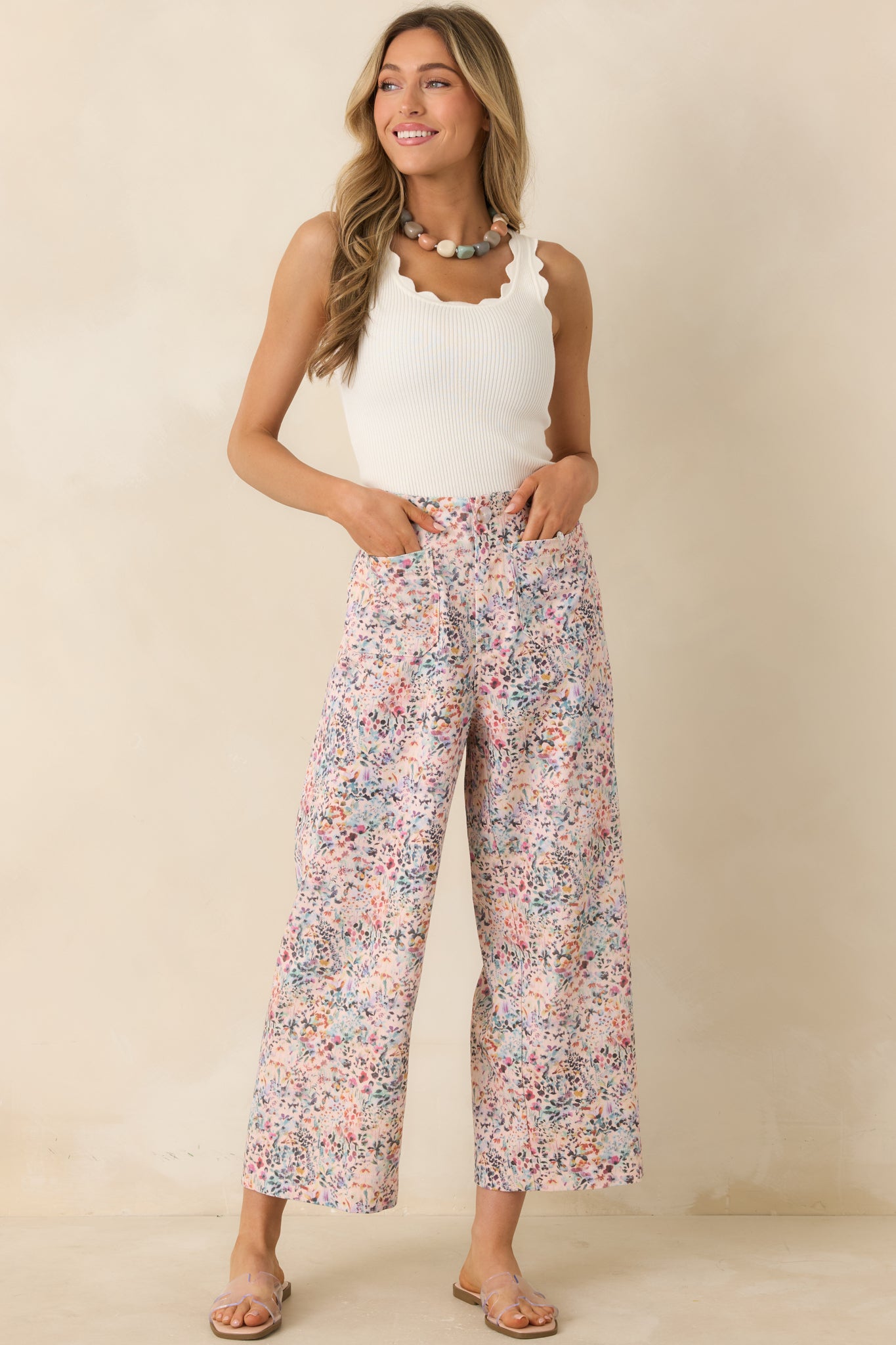 Lightweight wide leg pants with pink floral print and easy, flowing fit.