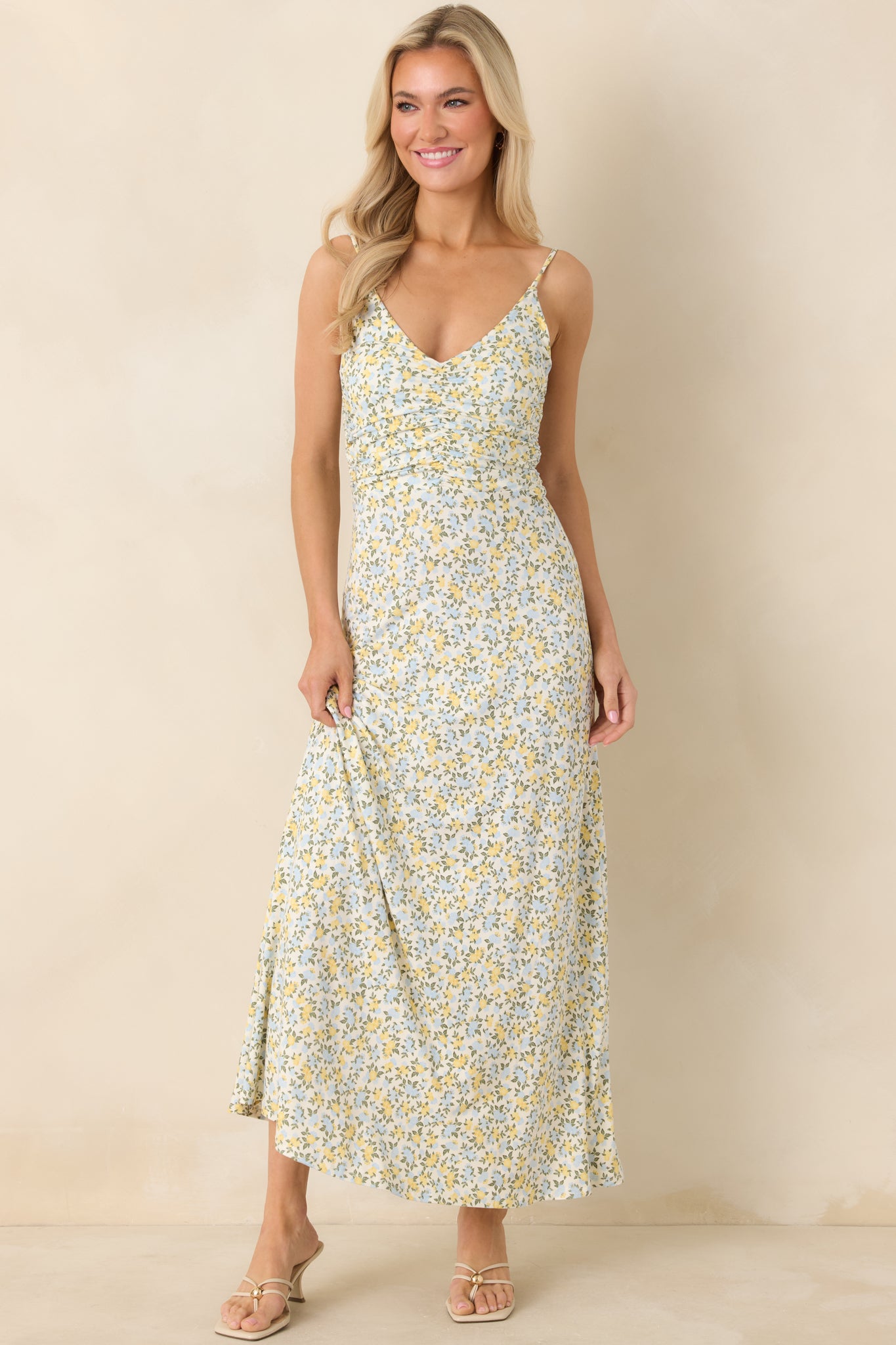 Lightweight woven maxi dress featuring a softly gathered bodice, flowy ankle-length skirt, and subtle floral pattern.
