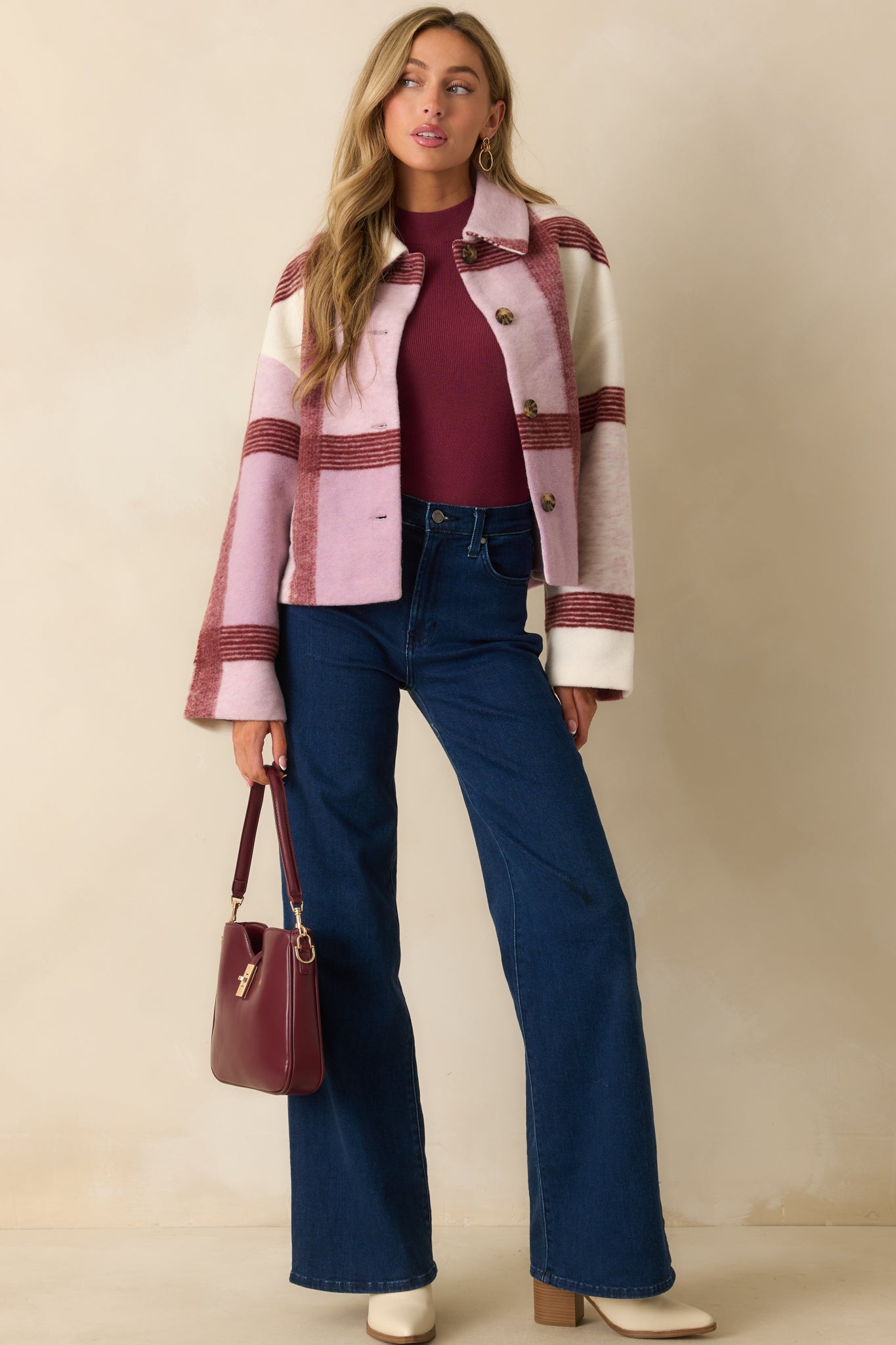 Lilac plaid jacket styled buttoned up, showing its relaxed boxy silhouette and soft brushed texture.