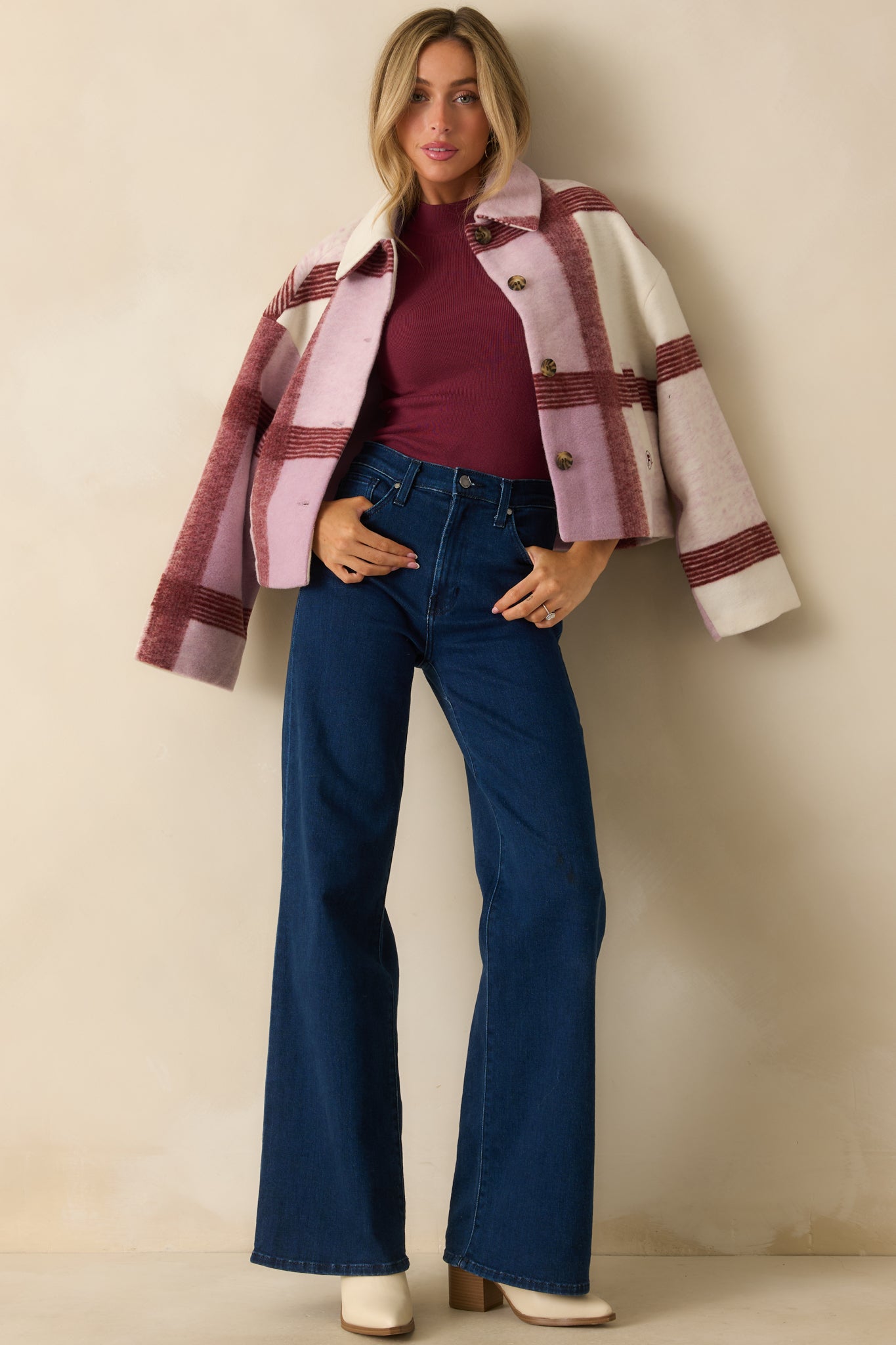 Wool-blend plaid jacket in lilac tones shown fully buttoned, highlighting its cozy structure and clean lines.