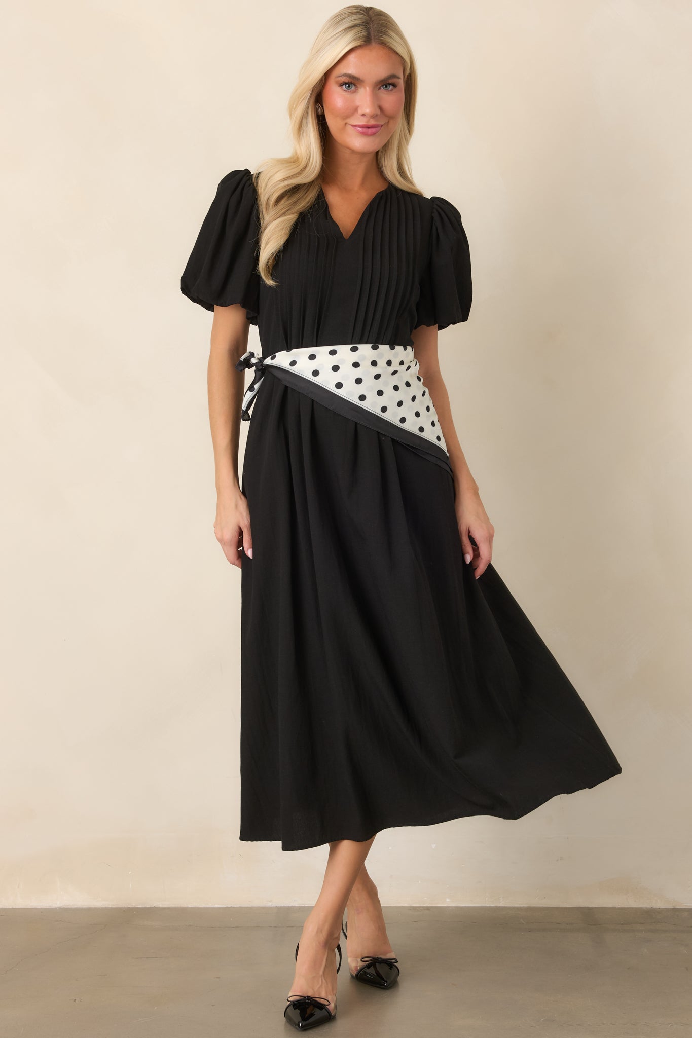 Linen-textured midi dress with delicate pintucks, voluminous puff sleeves, and an easy flowing silhouette with side pockets.