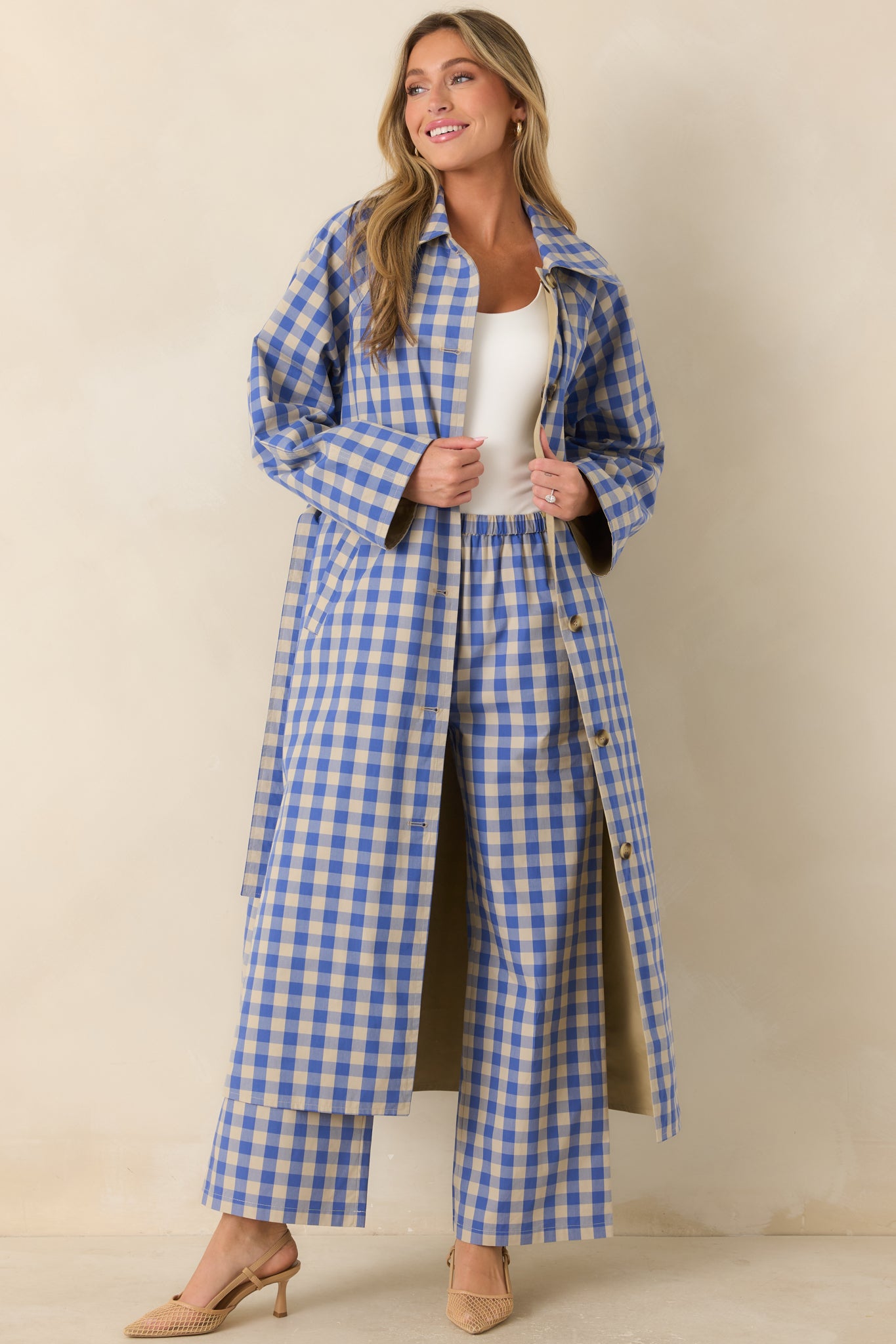 Long reversible coat crafted from cotton with the gingham print on display, finished with a removable waist tie and contrasting collar.