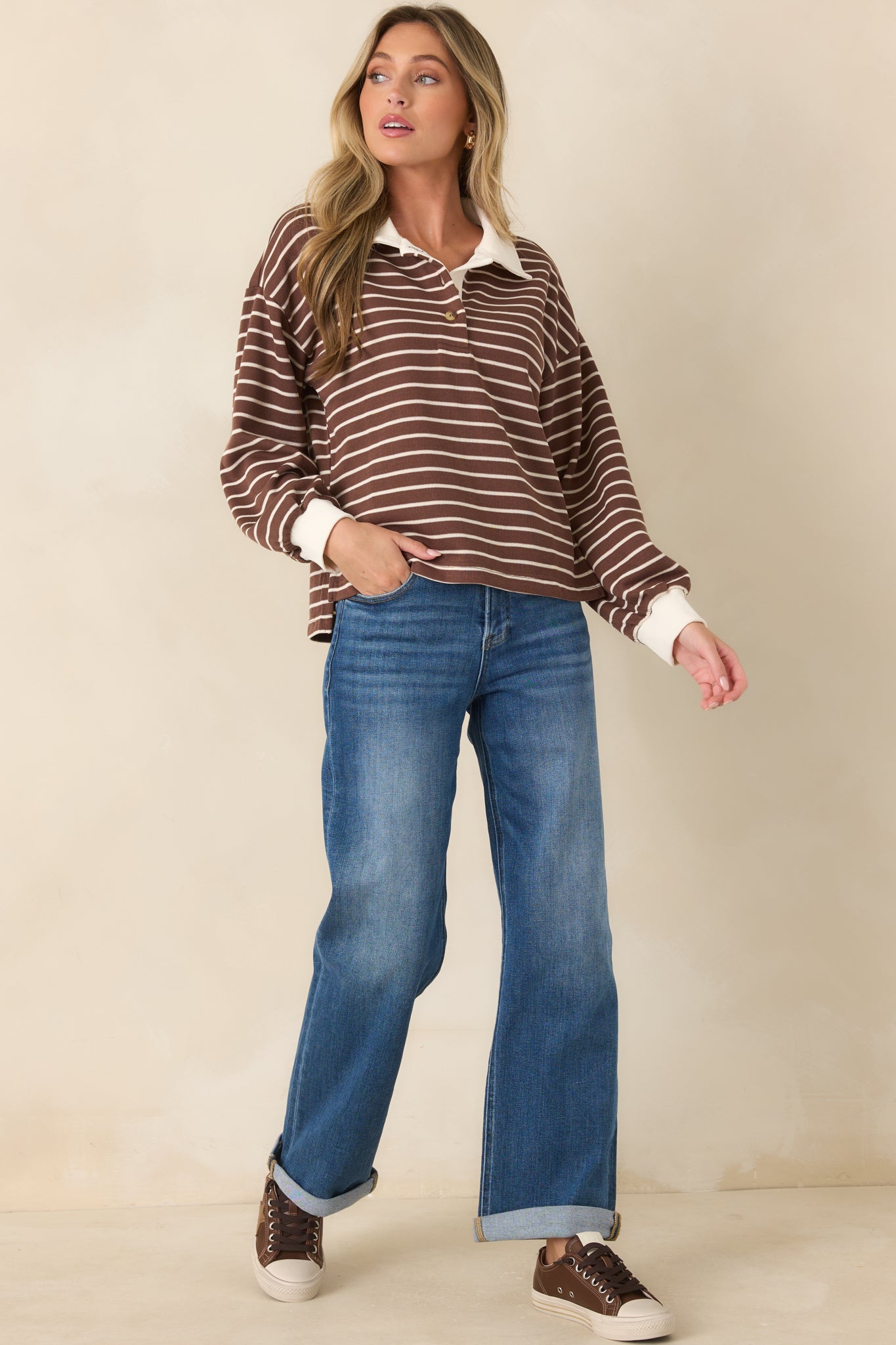 Long sleeve knit top featuring an easy silhouette, ivory trim accents, and a timeless striped design.